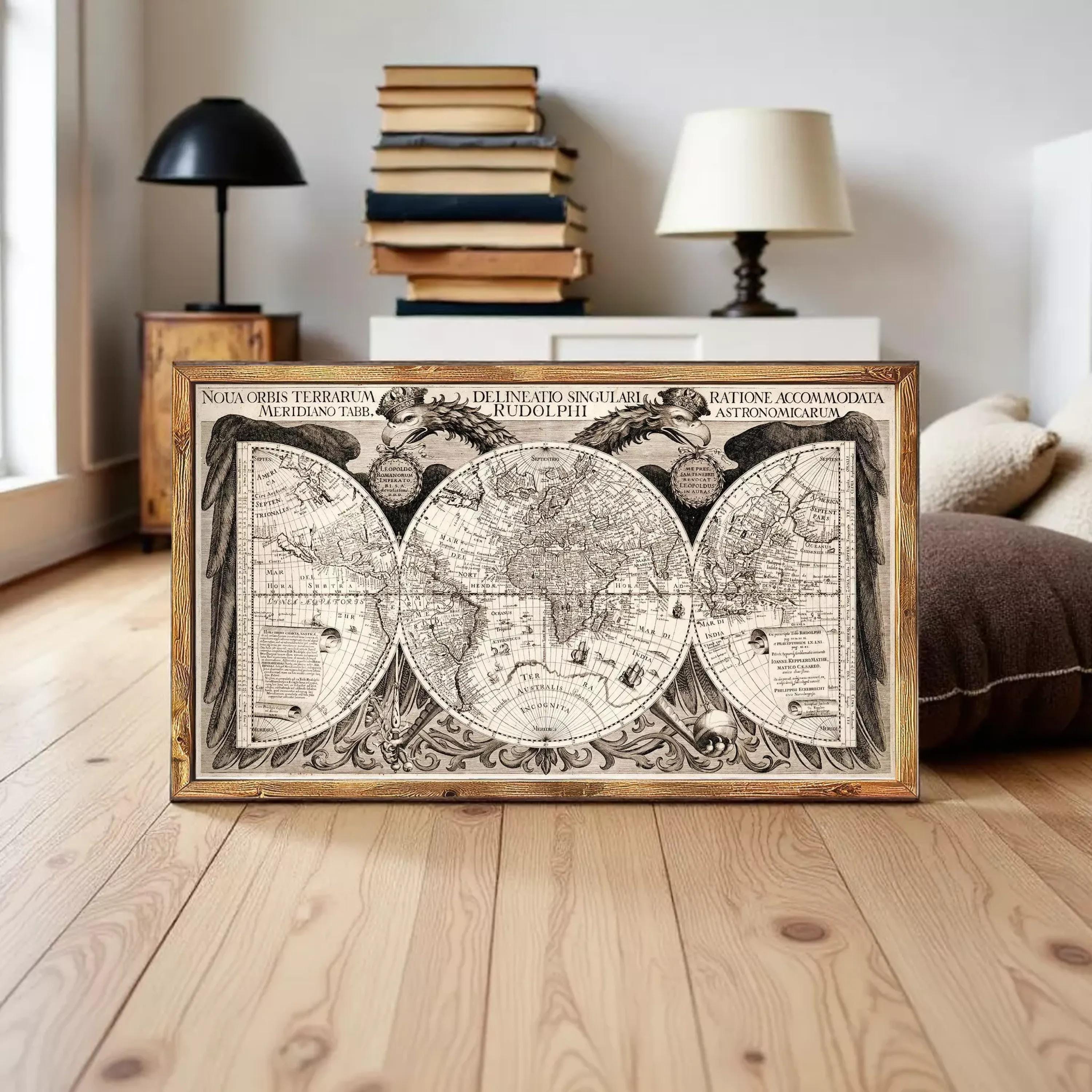 A framed vintage map of the world, featuring intricate details and decorative elements, is displayed on a wooden floor in a room with a bookshelf and lamp.