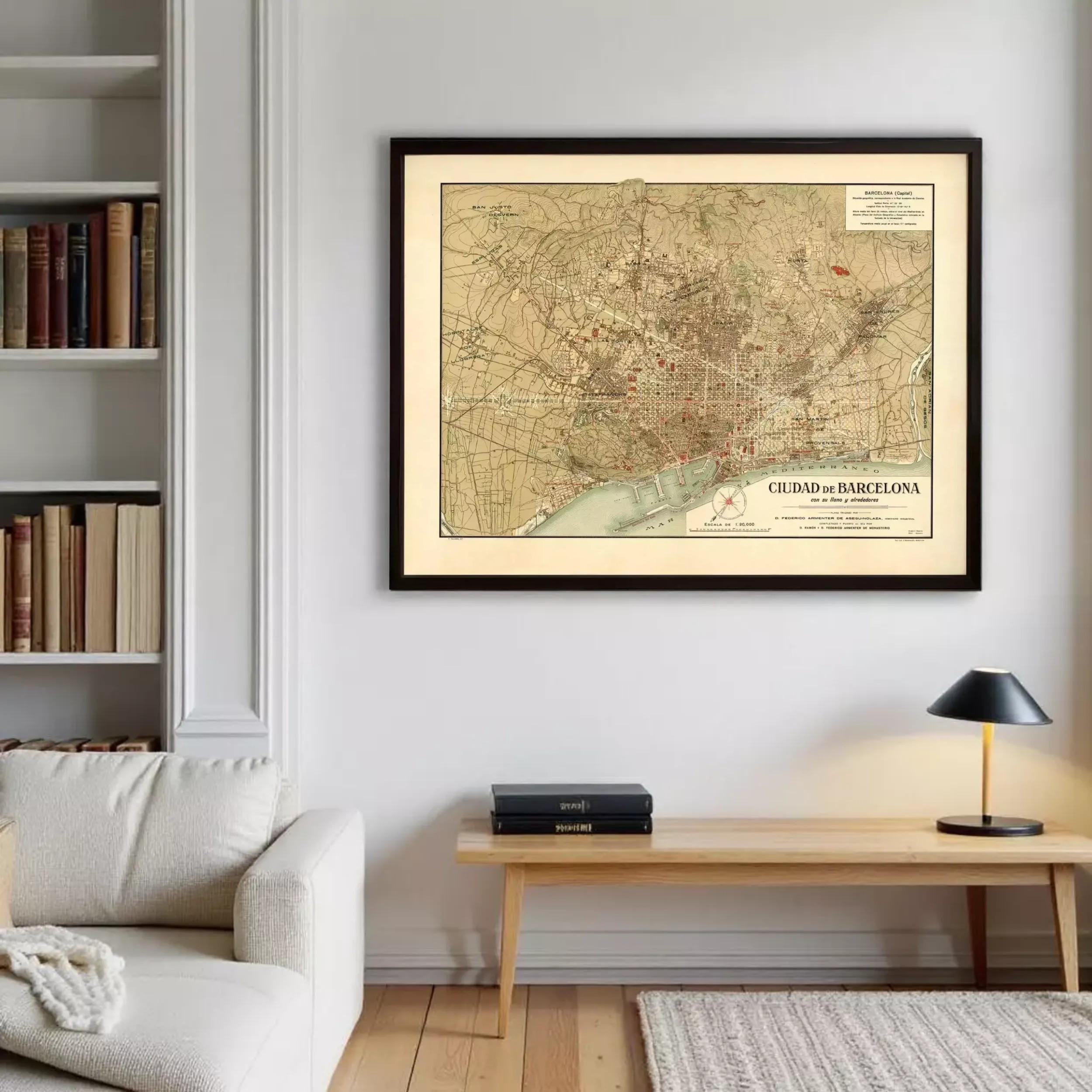 a framed map of Barcelona hanging on a wall in a living room.