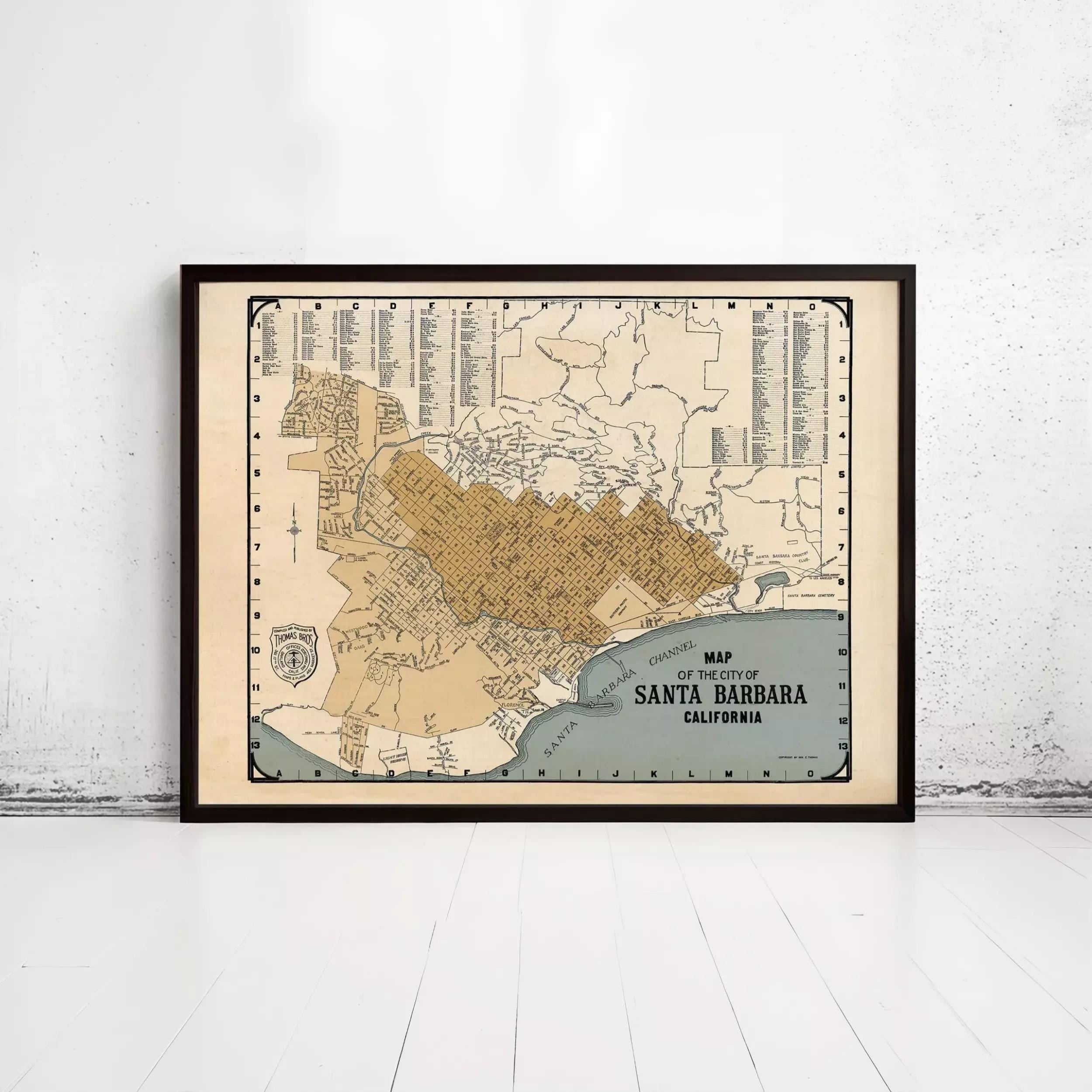 The image is a framed vintage map of Santa Barbara, California, depicting the city's streets and surrounding areas.