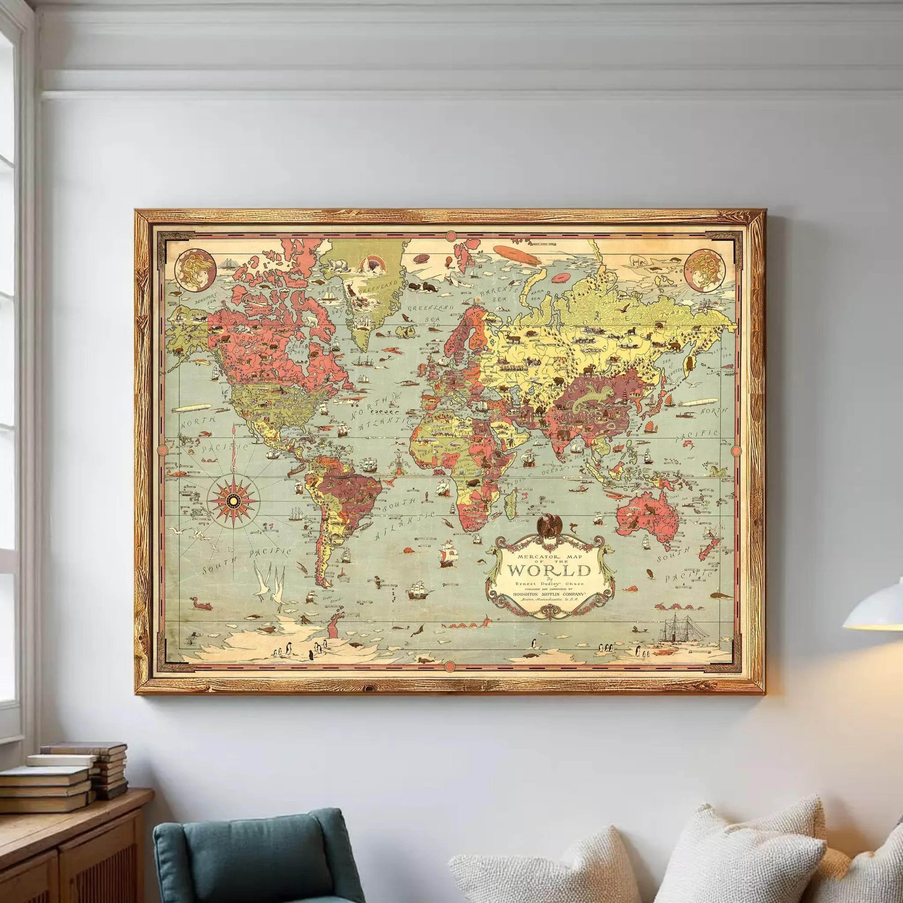 The image is a framed vintage world map with a wooden border, displayed on a white wall.