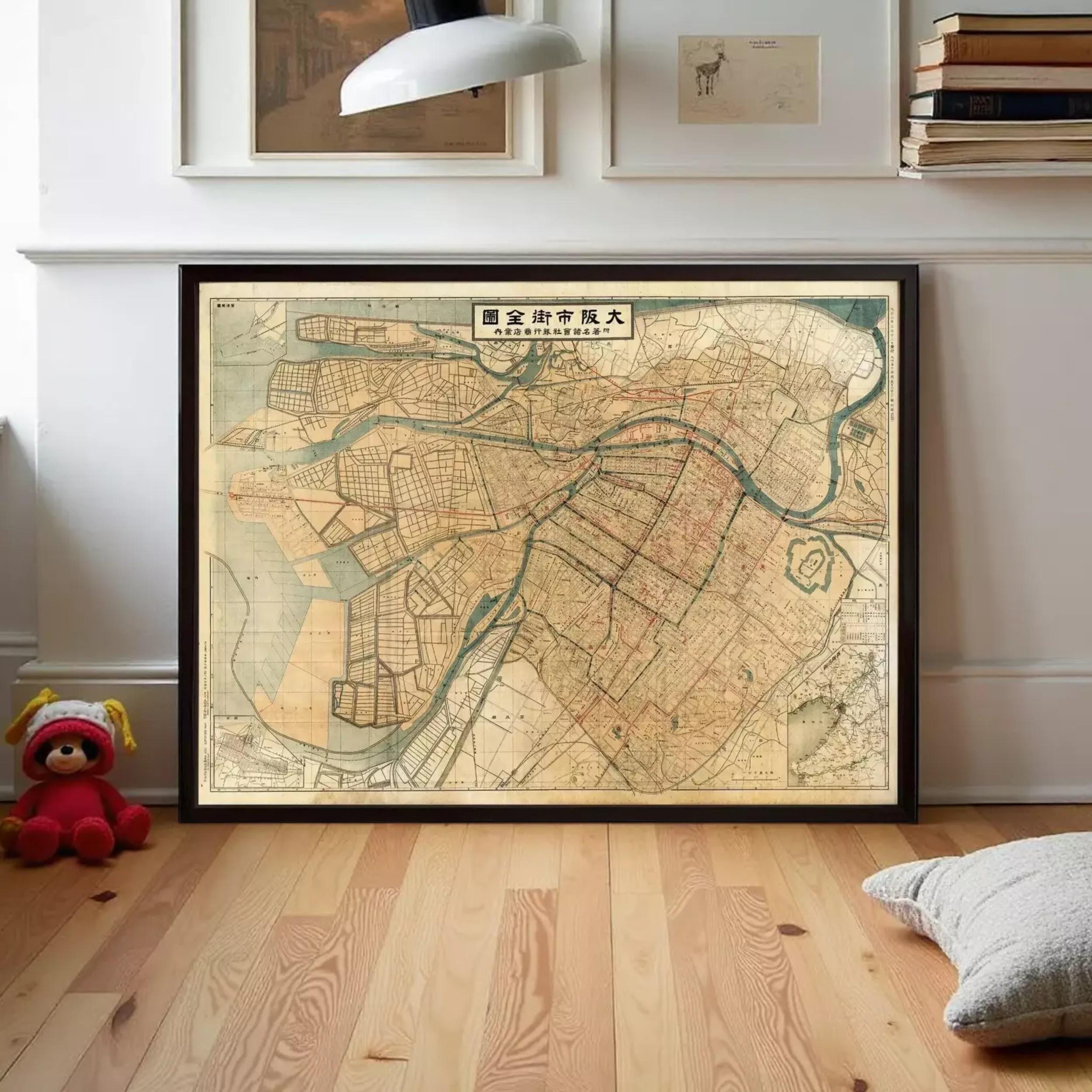 The image is a framed map of a city, likely Tokyo, with various streets and landmarks depicted.
