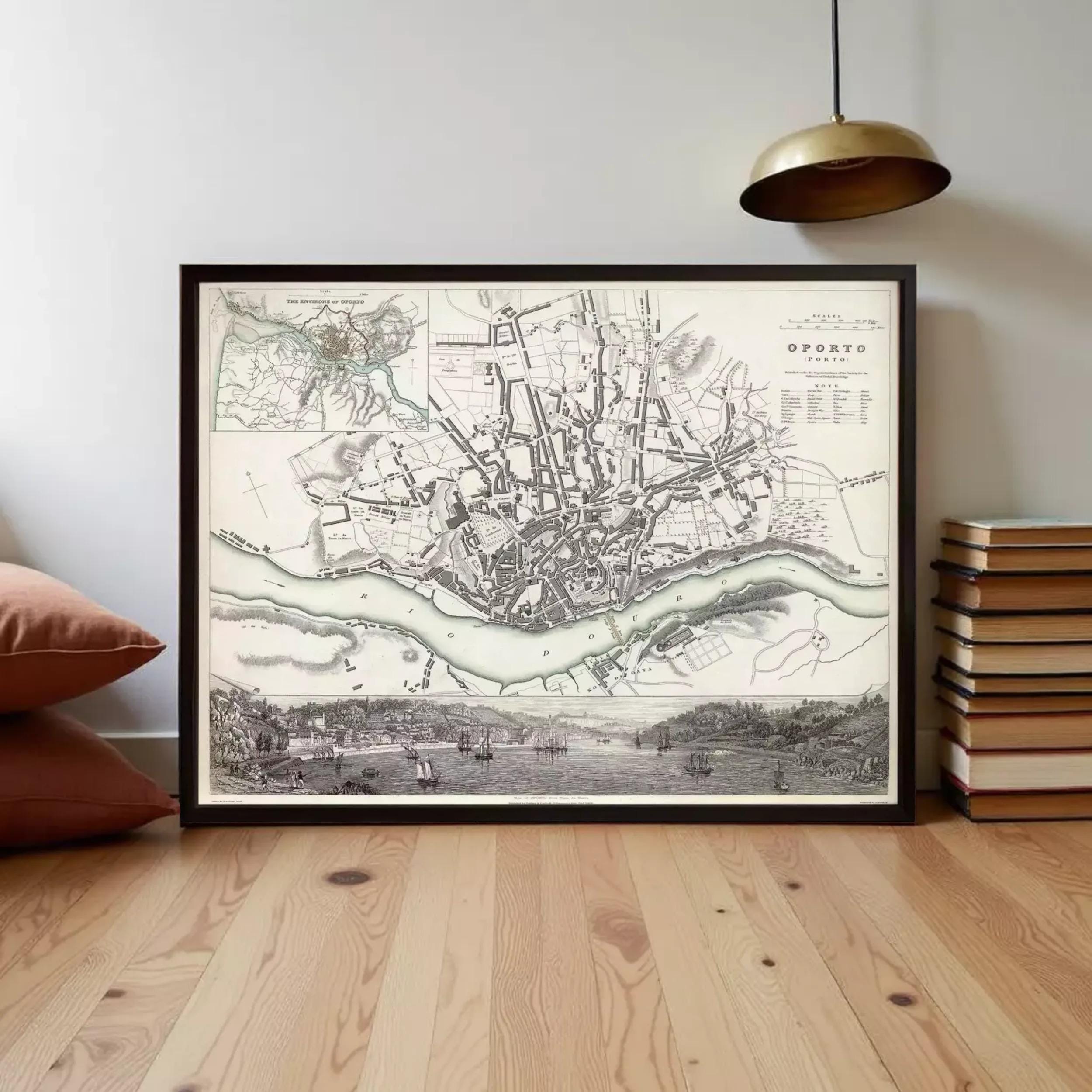 The image is a framed historical map of a city, depicting a detailed layout of the streets, rivers, and surrounding landscape.