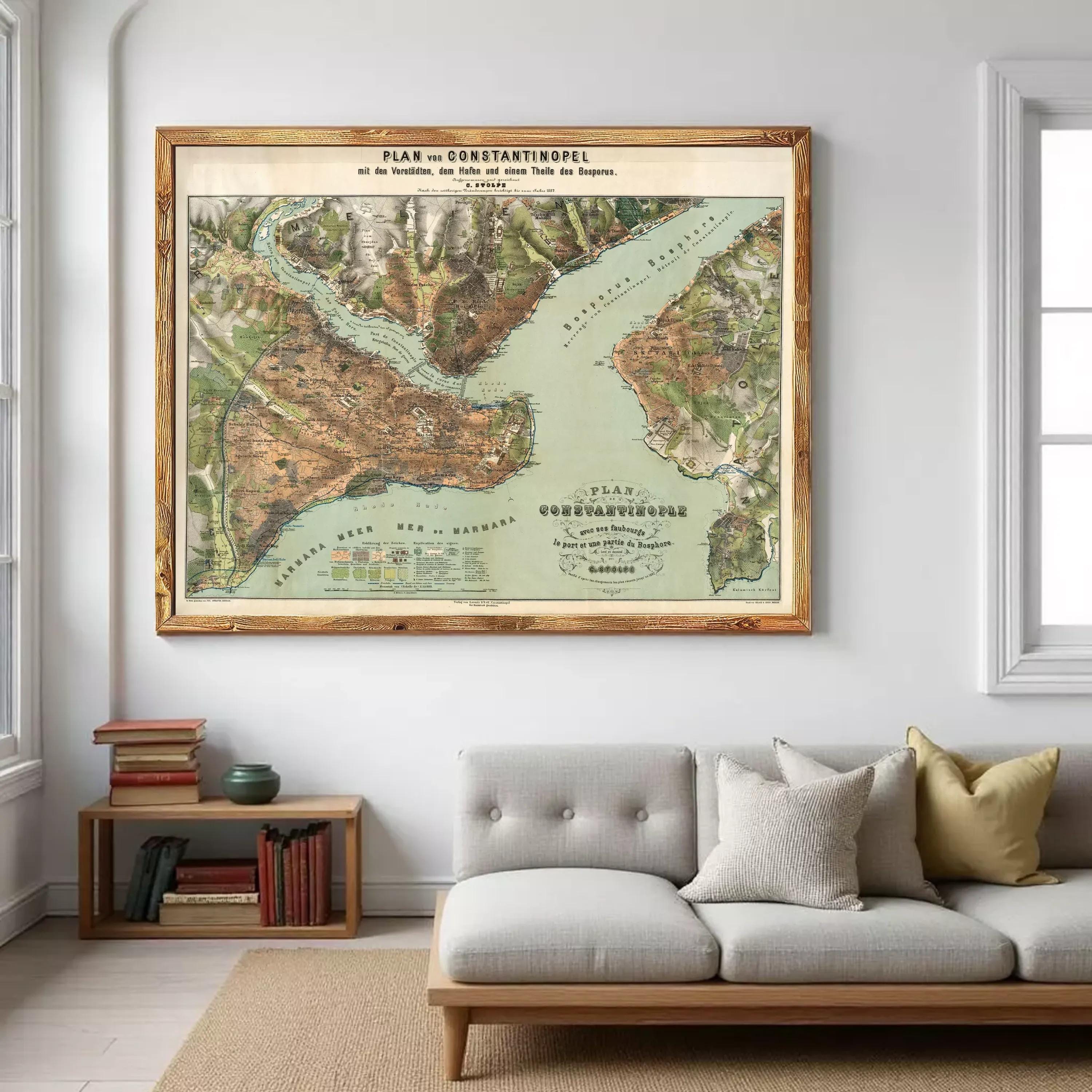 a large framed map of the world hanging on a wall in a living room.