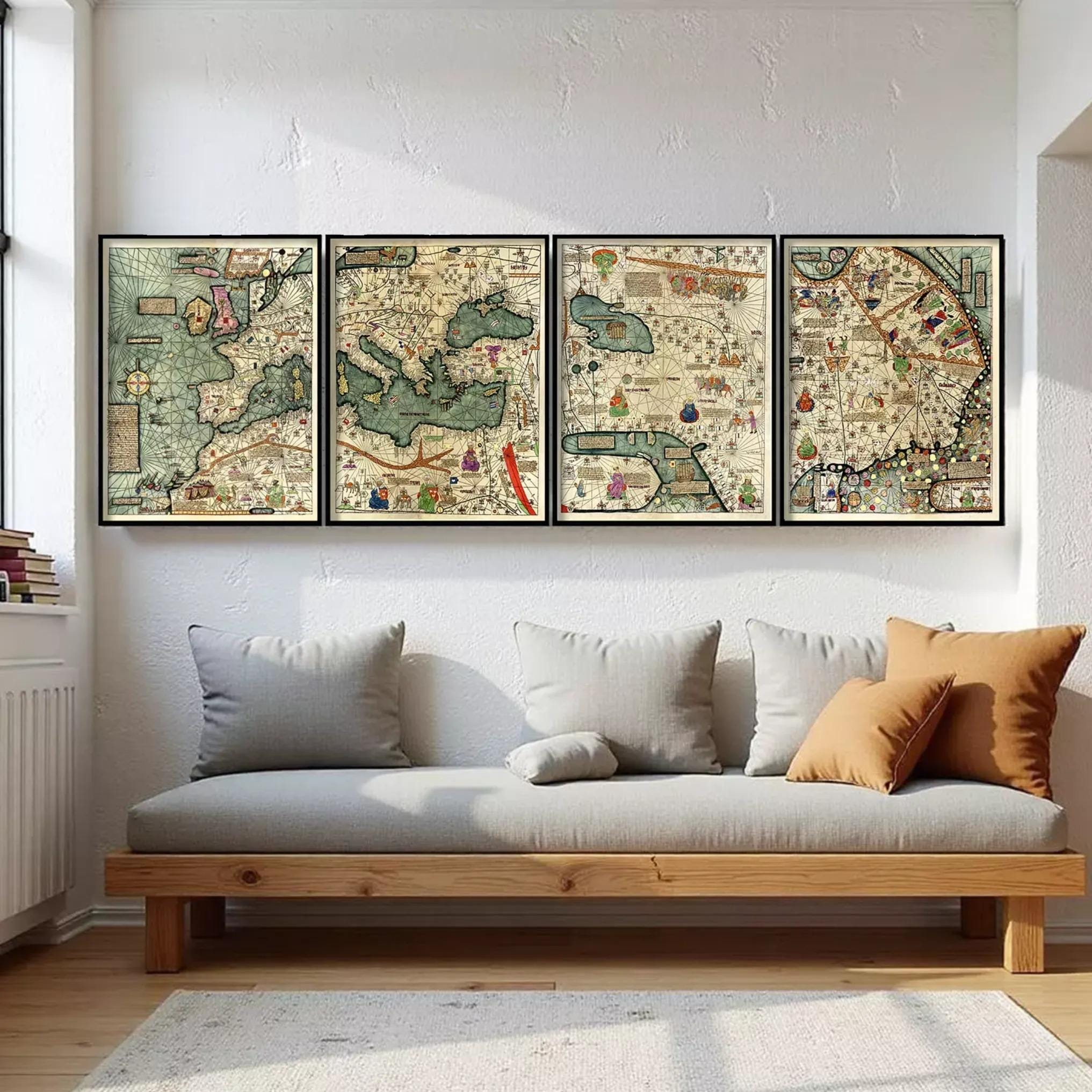 a cozy living room with a gray sofa and a wooden coffee table. Above the sofa, there is a wall with four framed maps hanging on it, depicting various landscapes and regions.