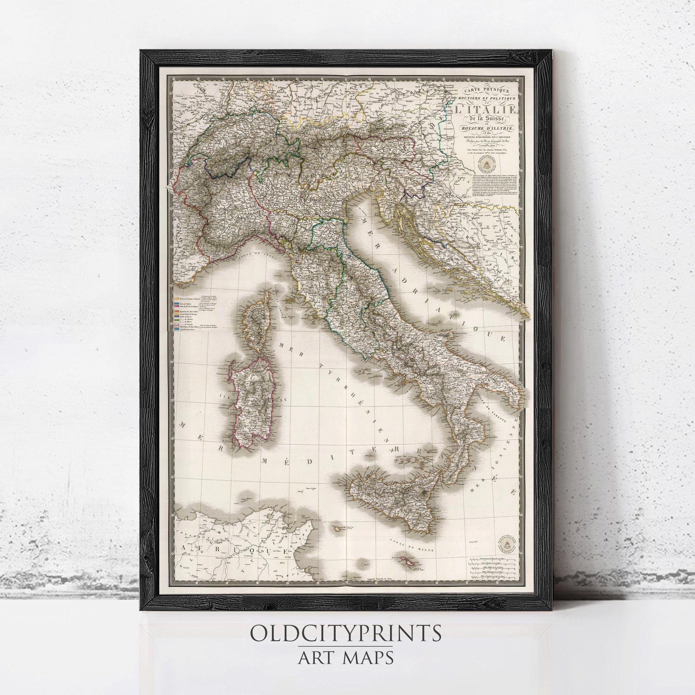 The image is a framed vintage map of Italy, depicting the country's geographical layout and surrounding areas.