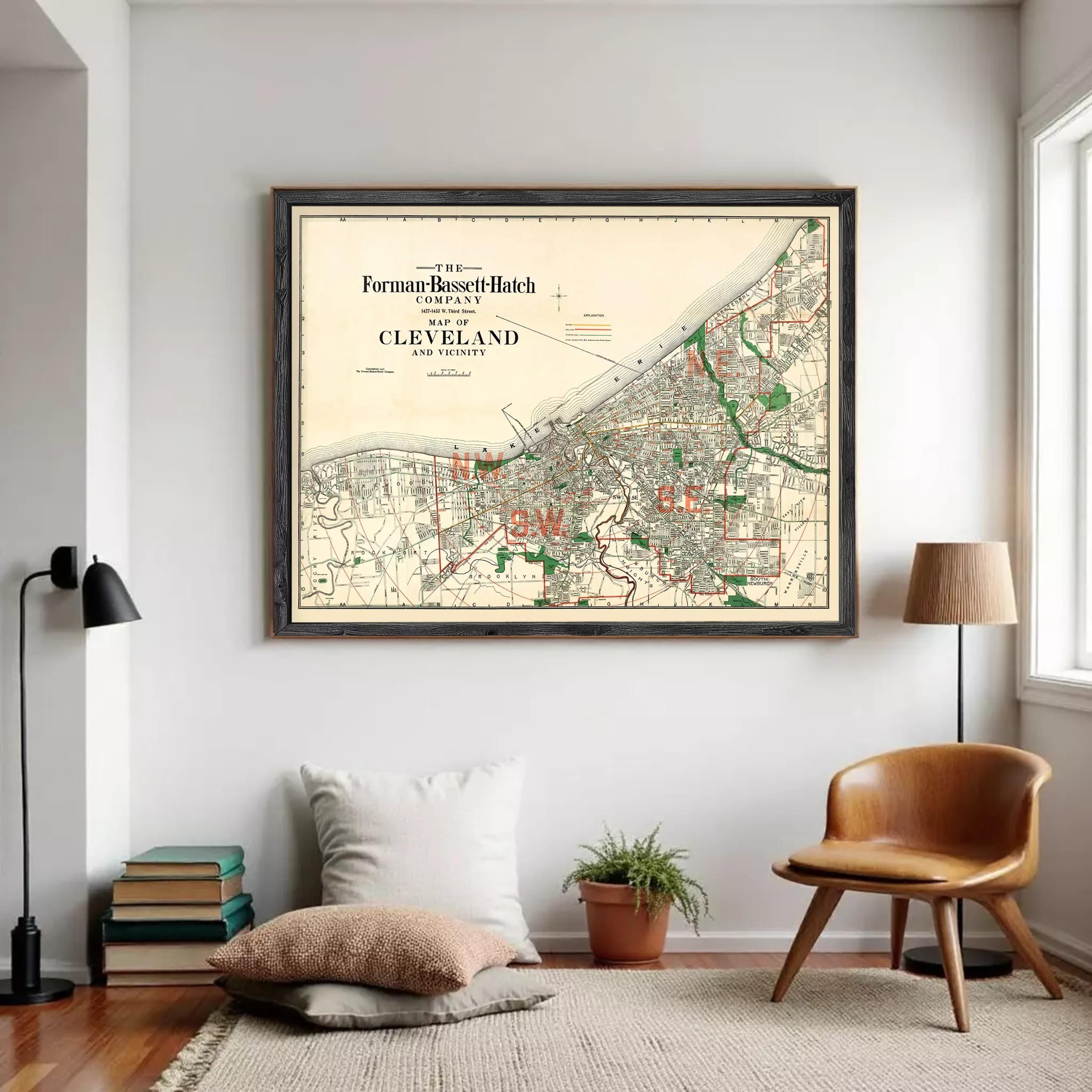 The image is a framed vintage map of Cleveland, Ohio, depicting the city's streets and surrounding areas.