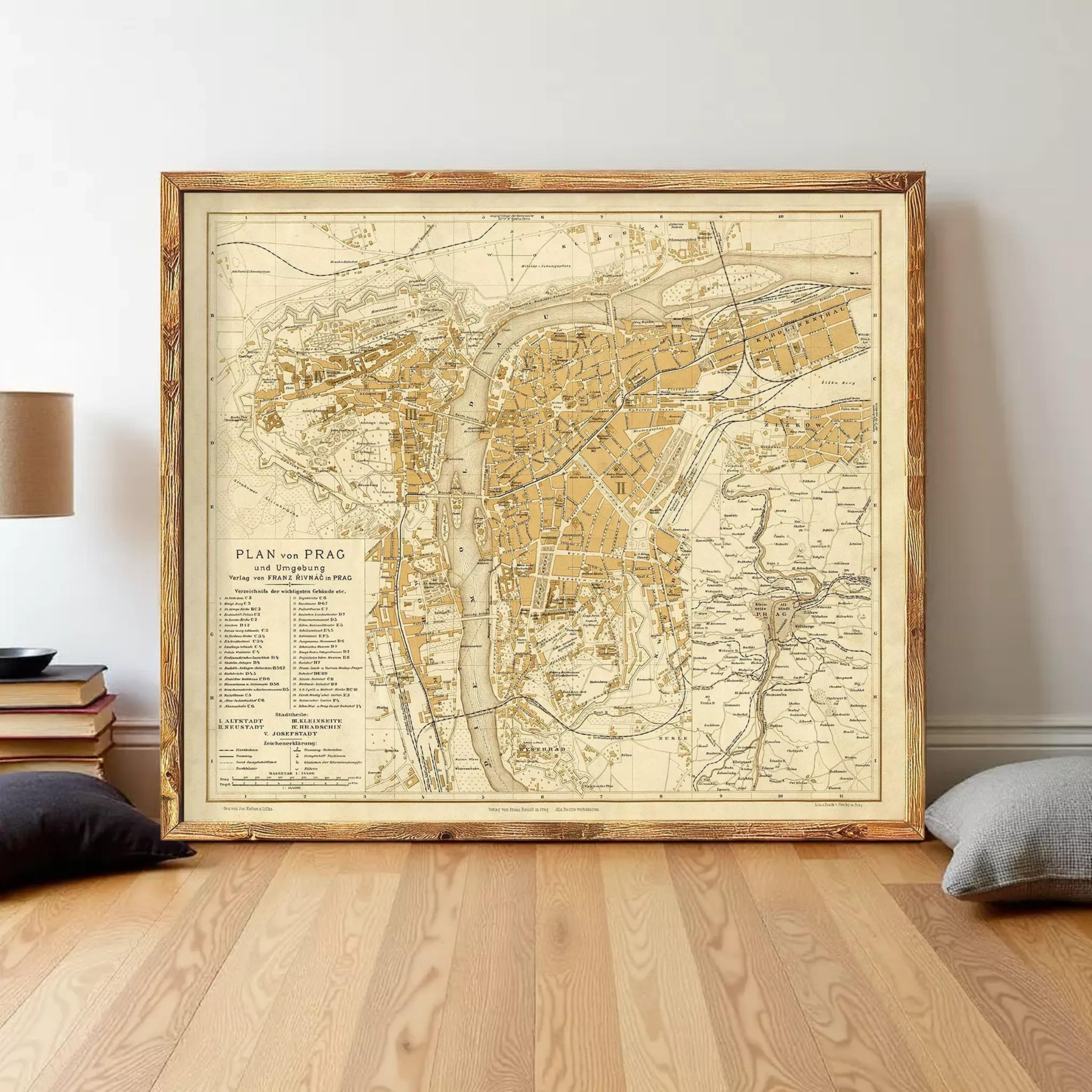 a large framed map of Prague, Czech Republic, with a wooden floor and a stack of books on the side.