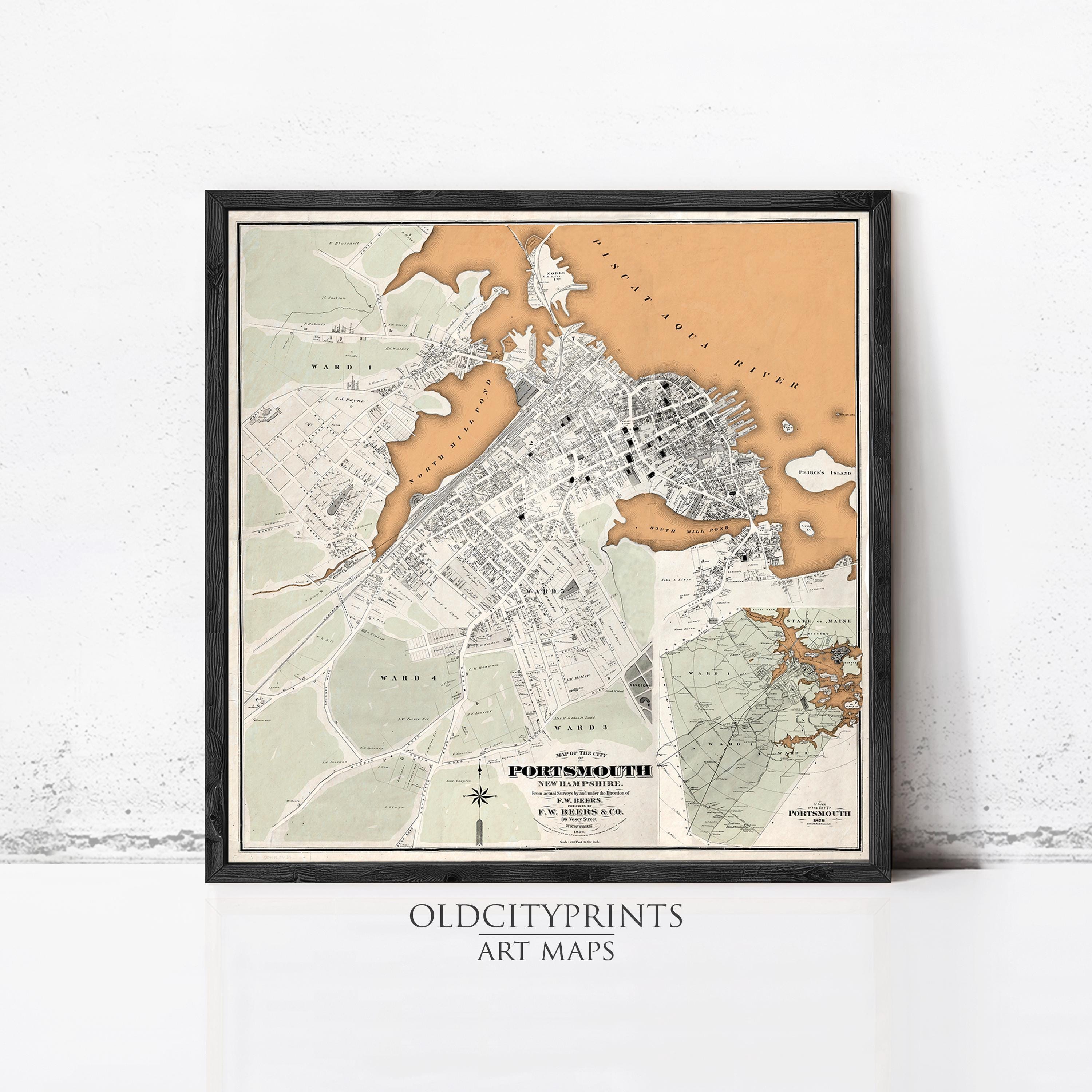 The image is a framed vintage map of the city of Portland, Oregon, with a black border and a beige and brown color scheme.