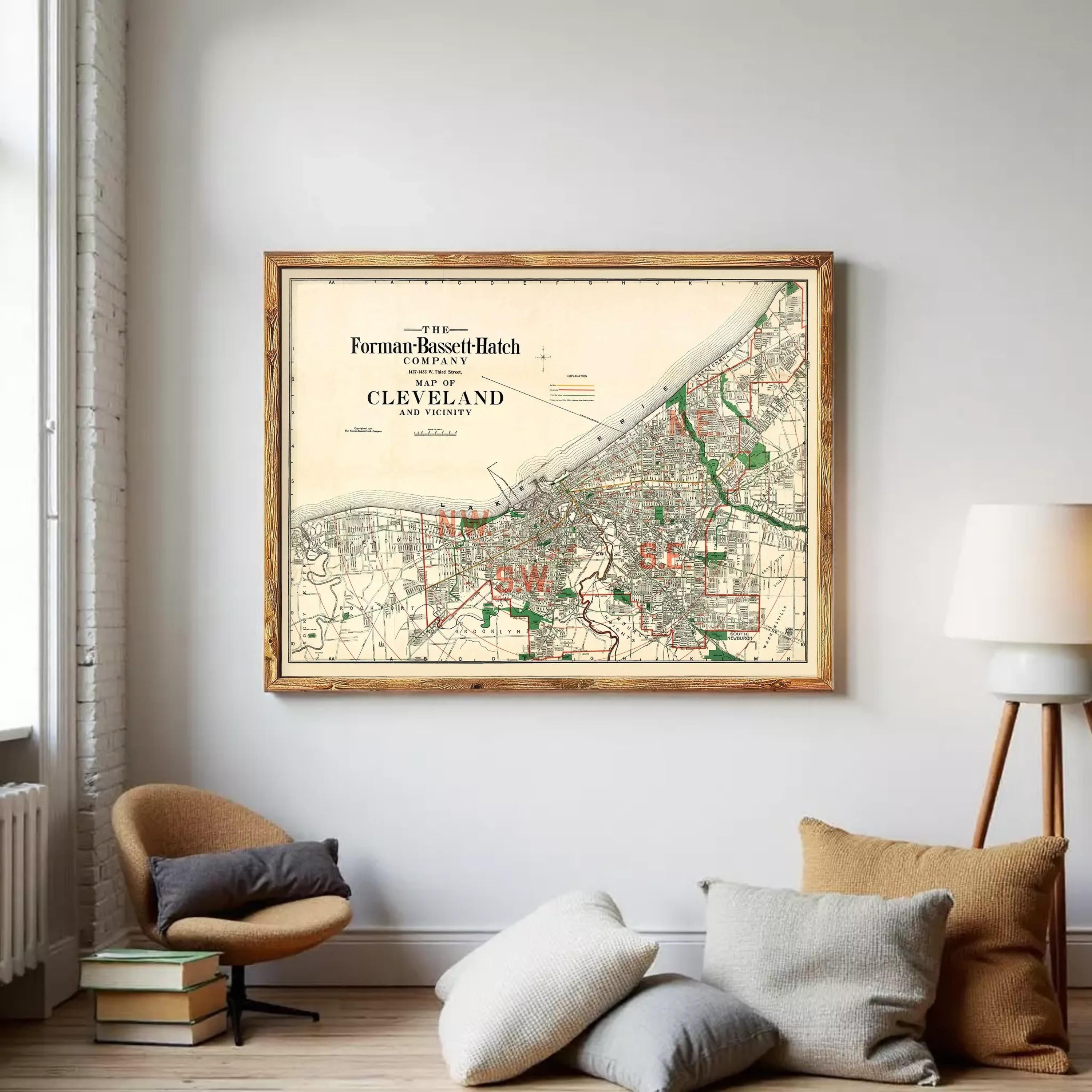 The image is a framed vintage map of Cleveland, Ohio, depicting the city's streets and surrounding areas.