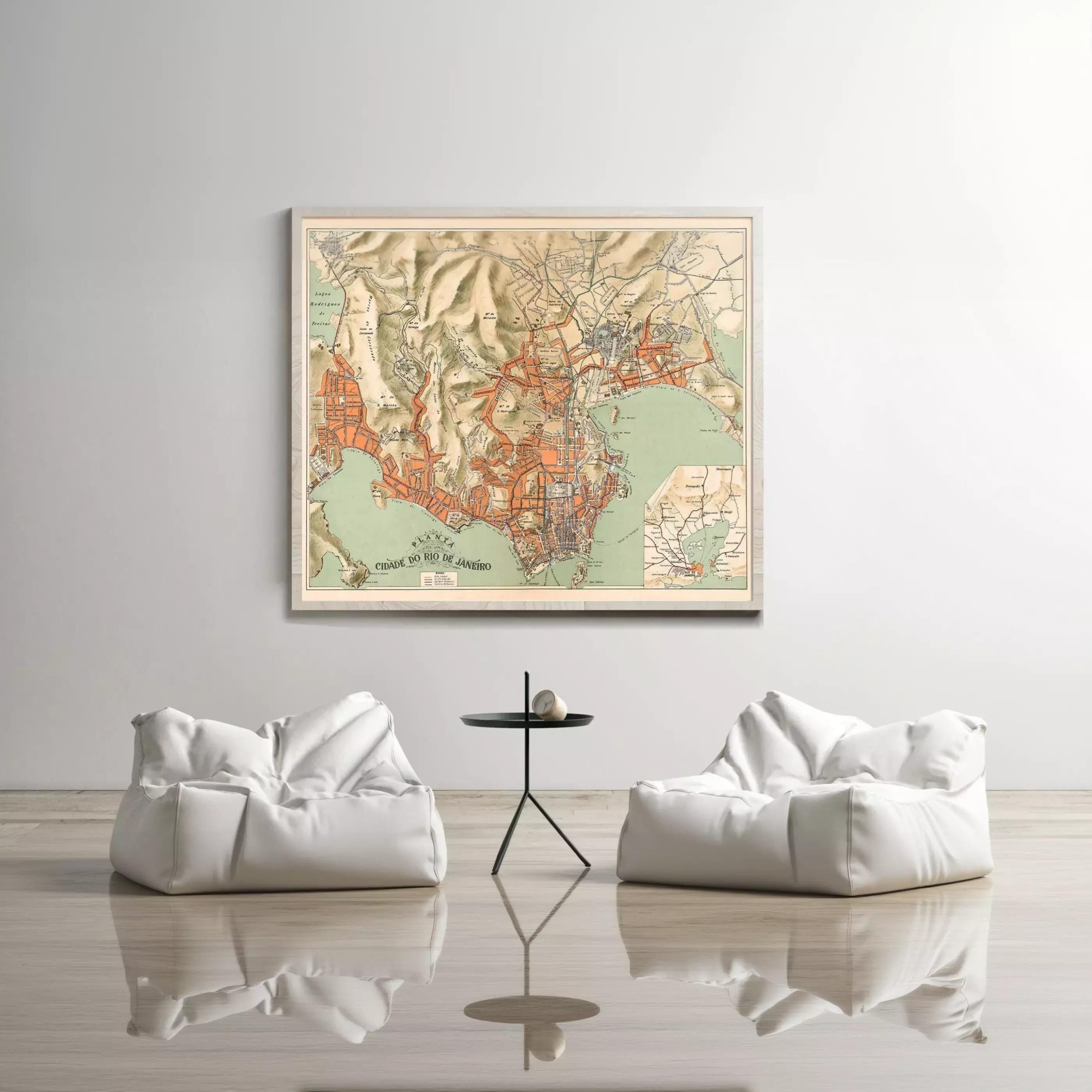 a large framed map of a city hanging on a wall, with two white bean bag chairs positioned in front of it.