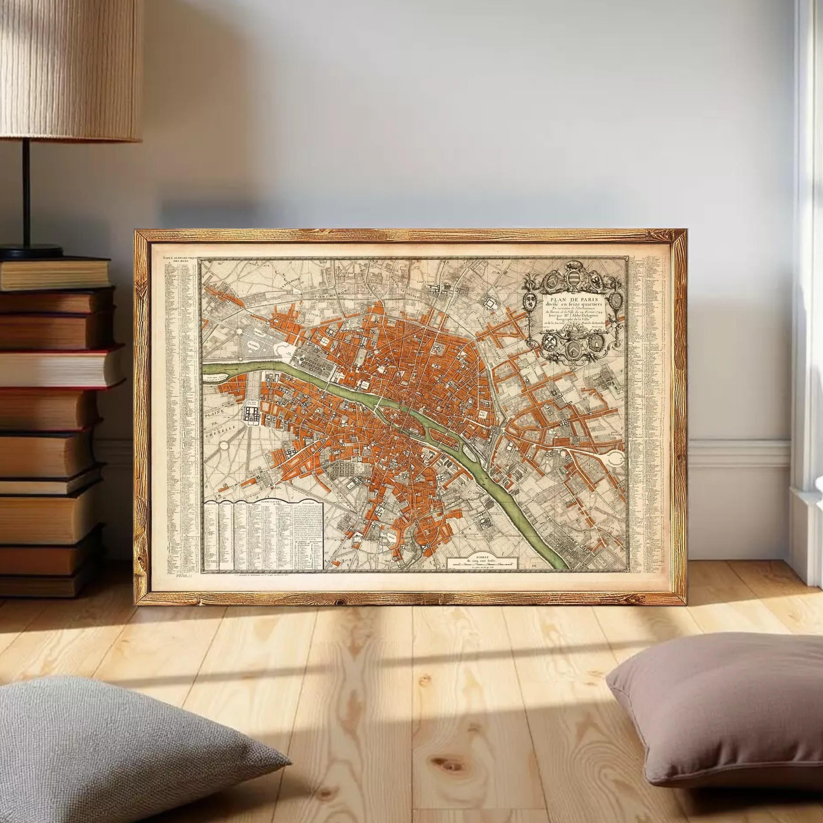 The image is a framed vintage map of a city, likely Paris, with a detailed and intricate design.