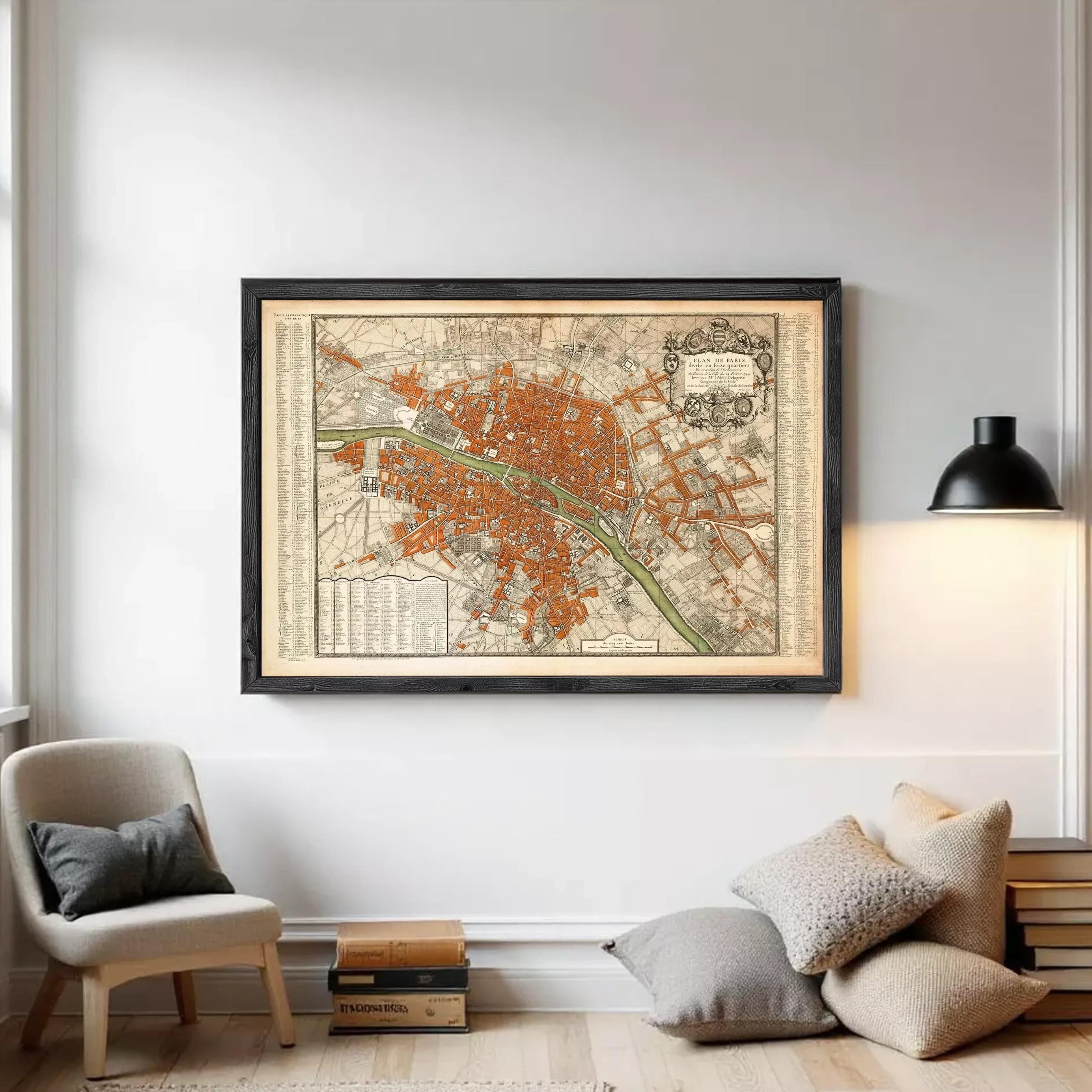 The image is a framed vintage map of a city, likely Paris, with a detailed and intricate design.