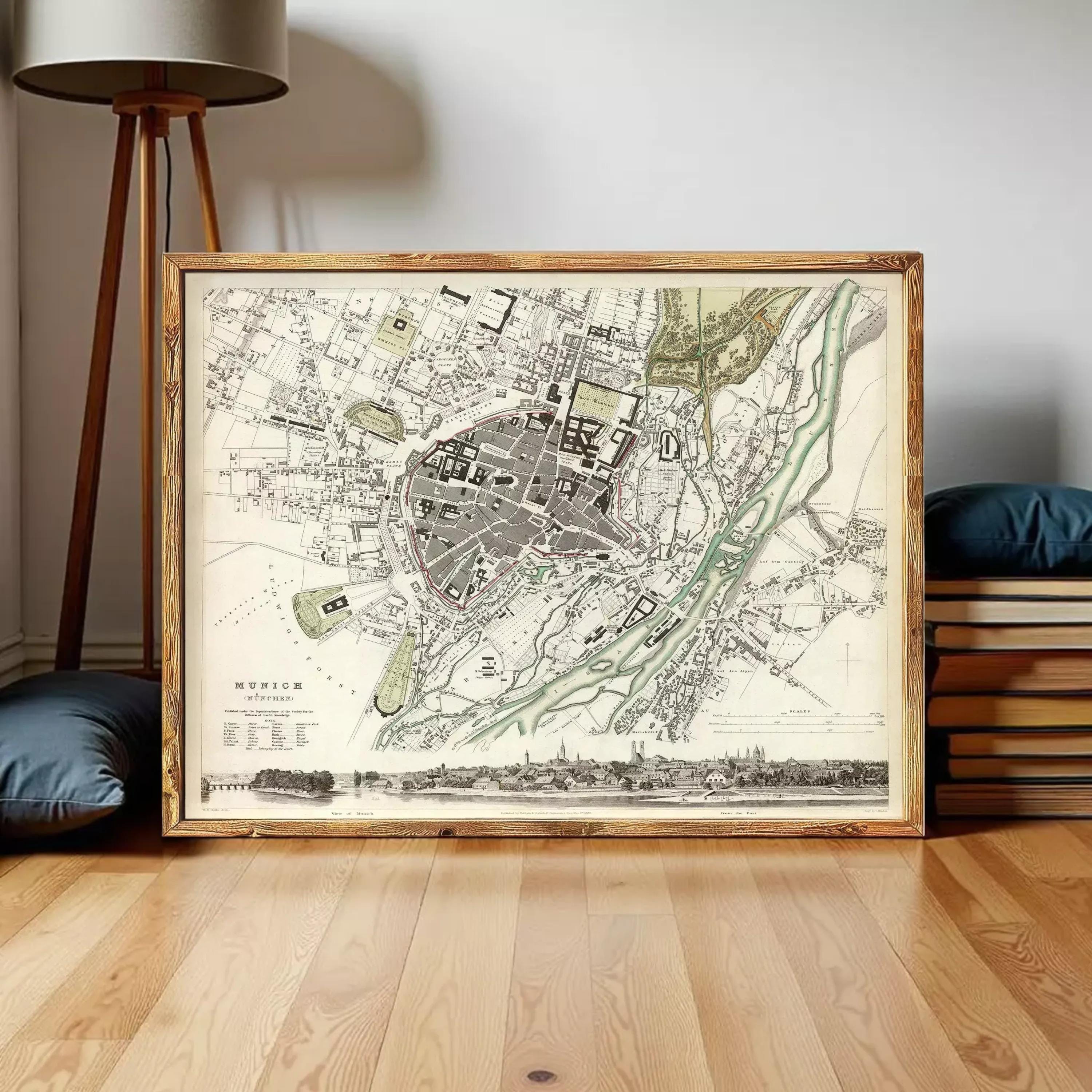 The image is a framed vintage map of a city, depicting a detailed layout of streets, buildings, and other urban features.