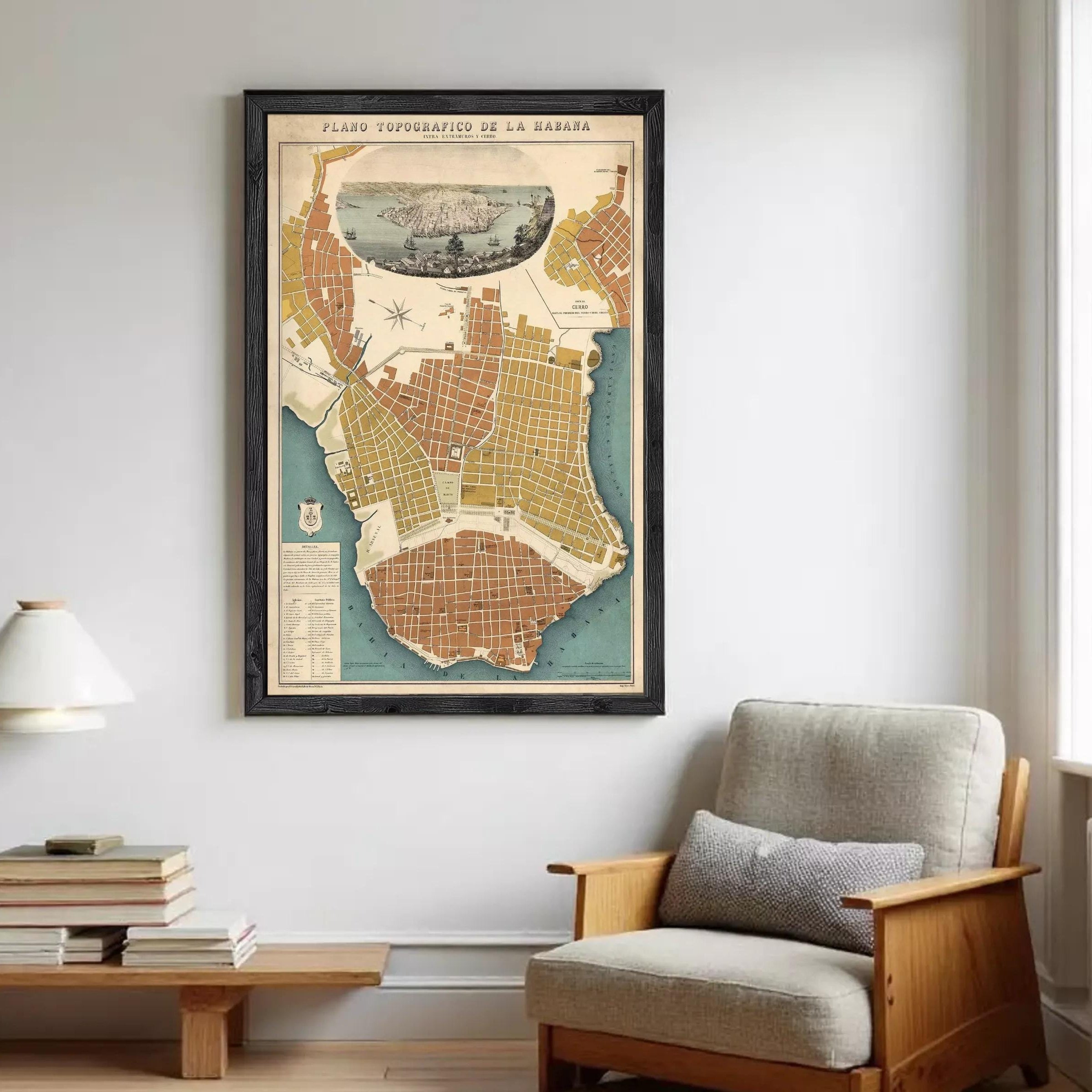 The image is a framed vintage map of a city, likely Havana, Cuba, with a detailed illustration of the city's layout and surrounding areas.