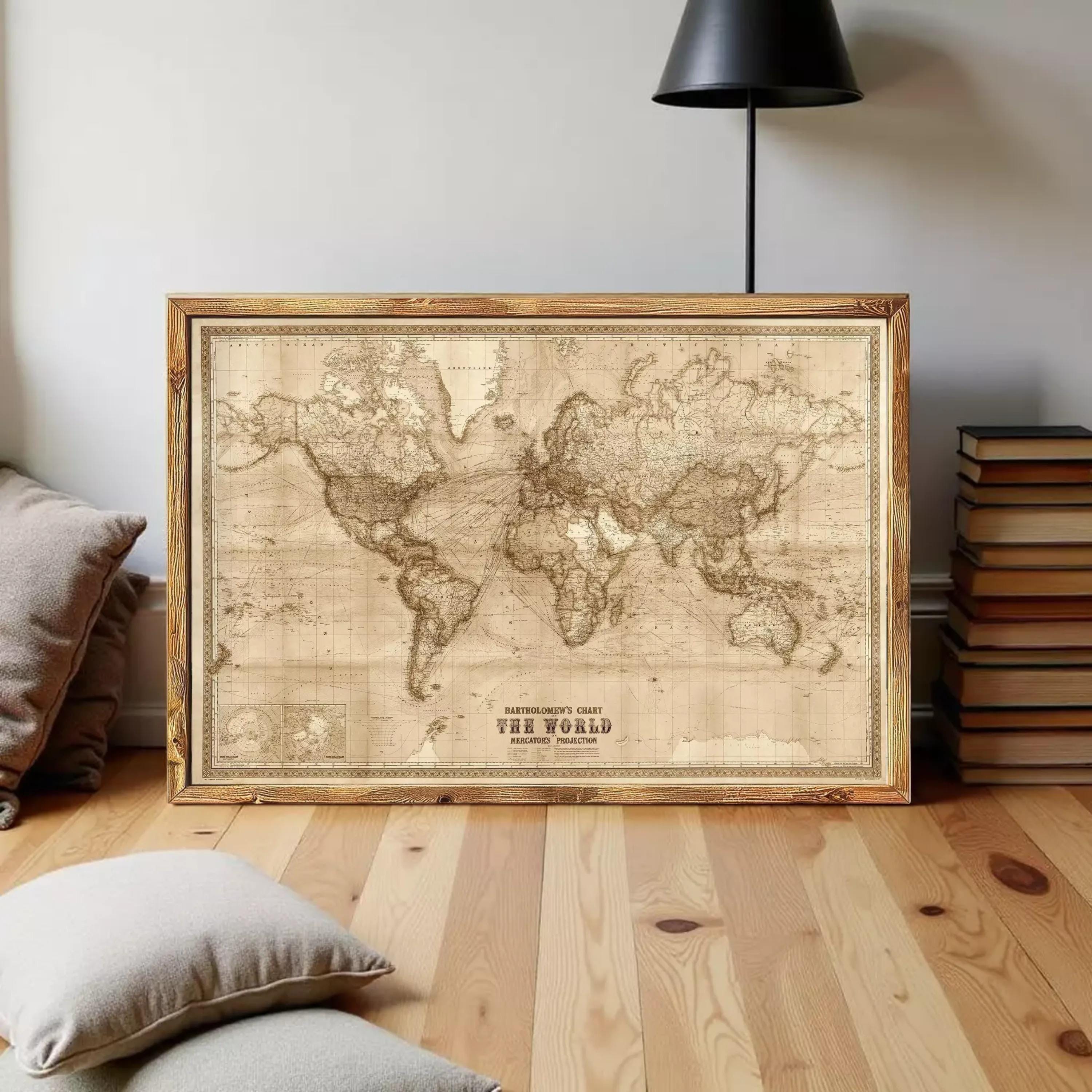 a large world map in a wooden frame, placed on a wooden floor in a room with a lamp and some books.