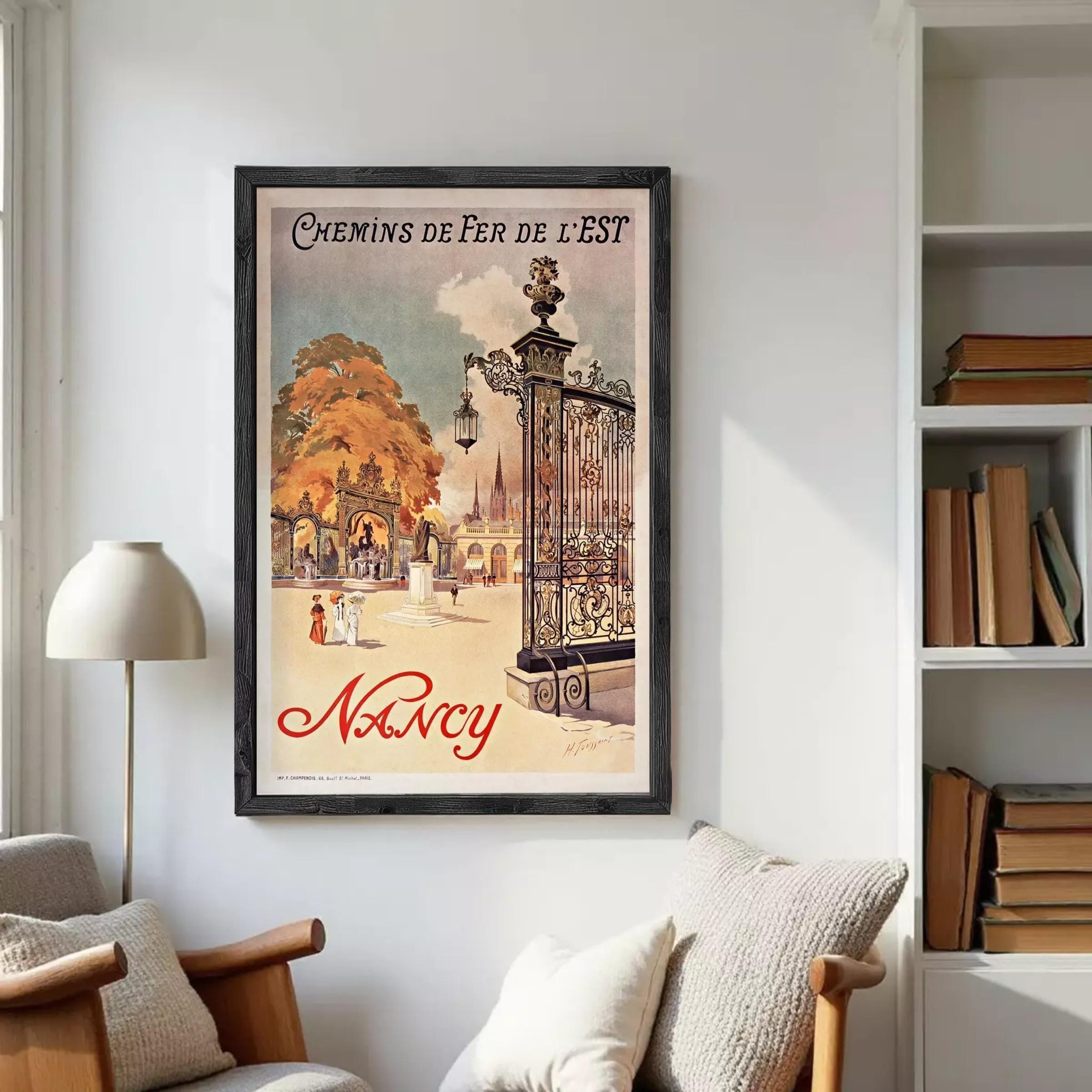 A framed vintage poster advertising Nancy, featuring an illustration of a park scene with people and a gazebo.