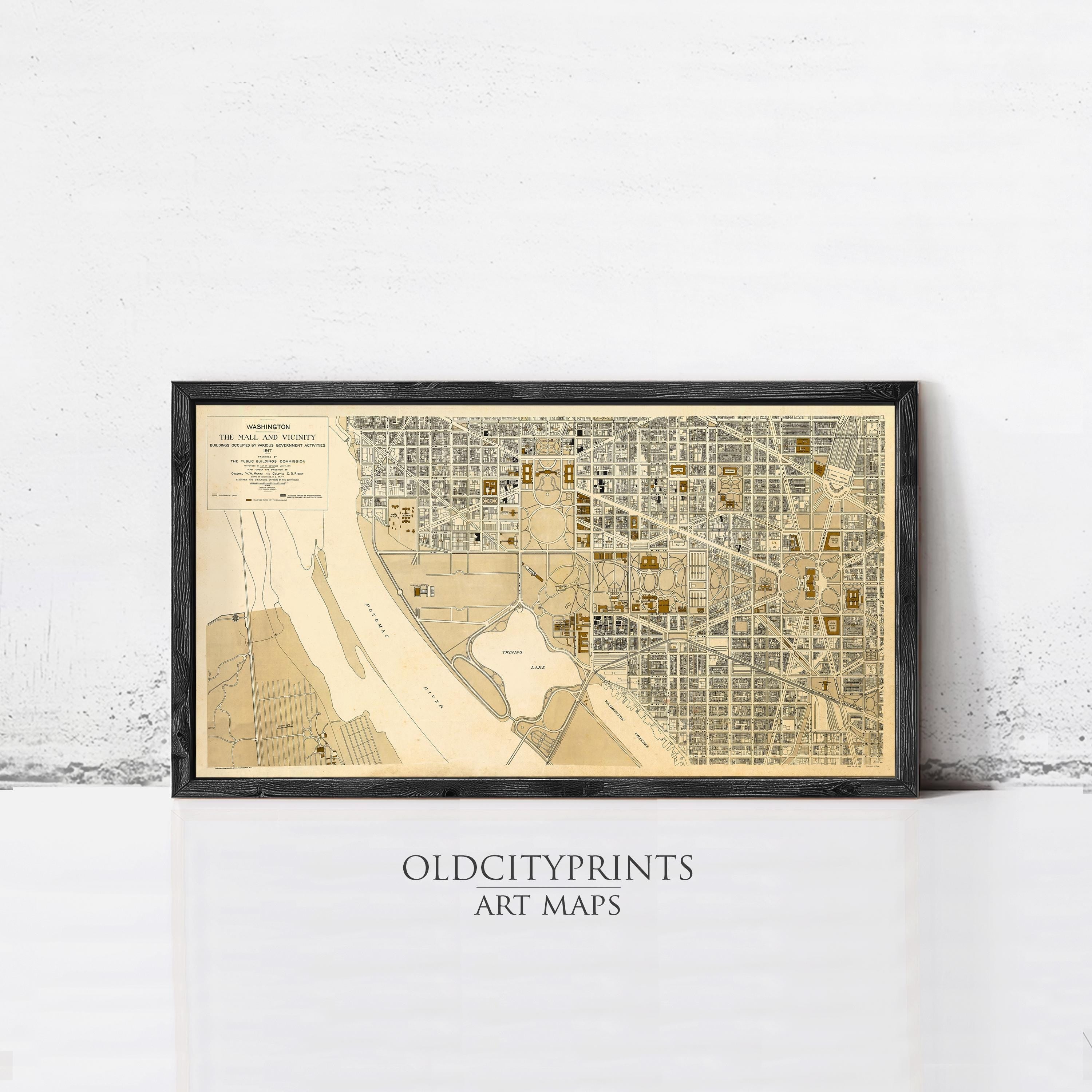 The image is a framed art print depicting a map of a city, with a focus on the streets and surrounding areas.