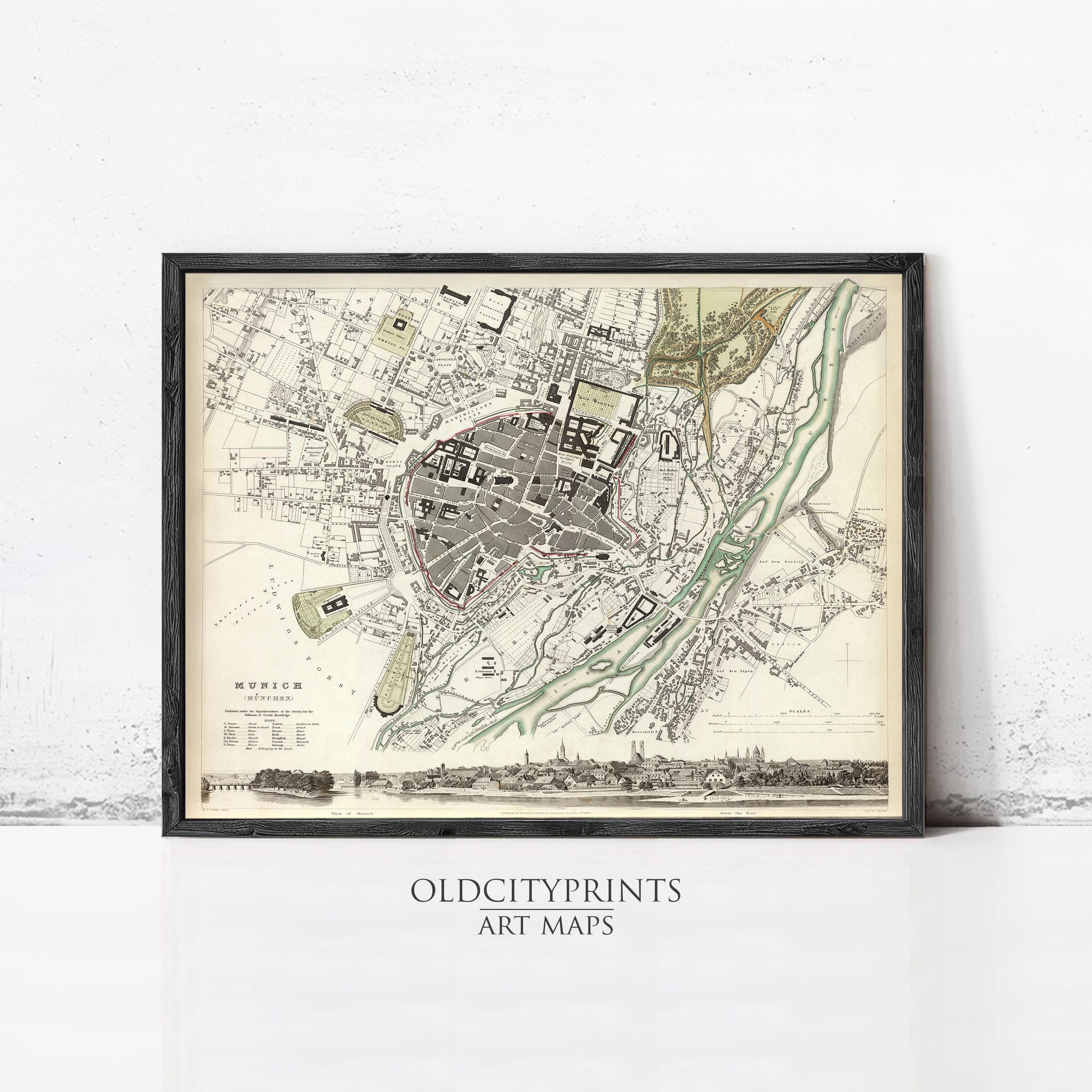 The image is a framed vintage map of a city, likely from the 19th century, with detailed street and building plans.
