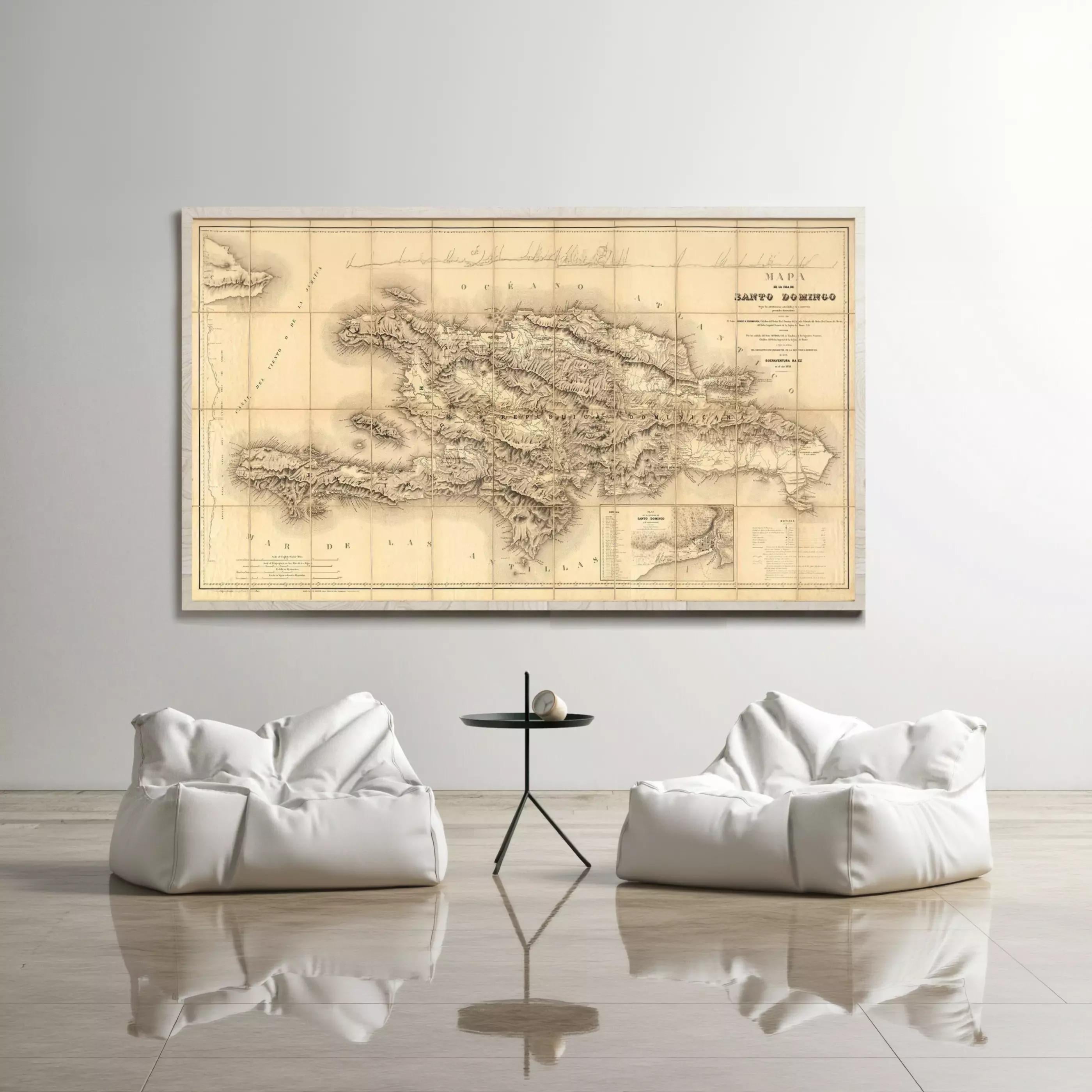 a large map of the island of San Tomo, Italy, hanging on a wall above a seating area with two white bean bag chairs.