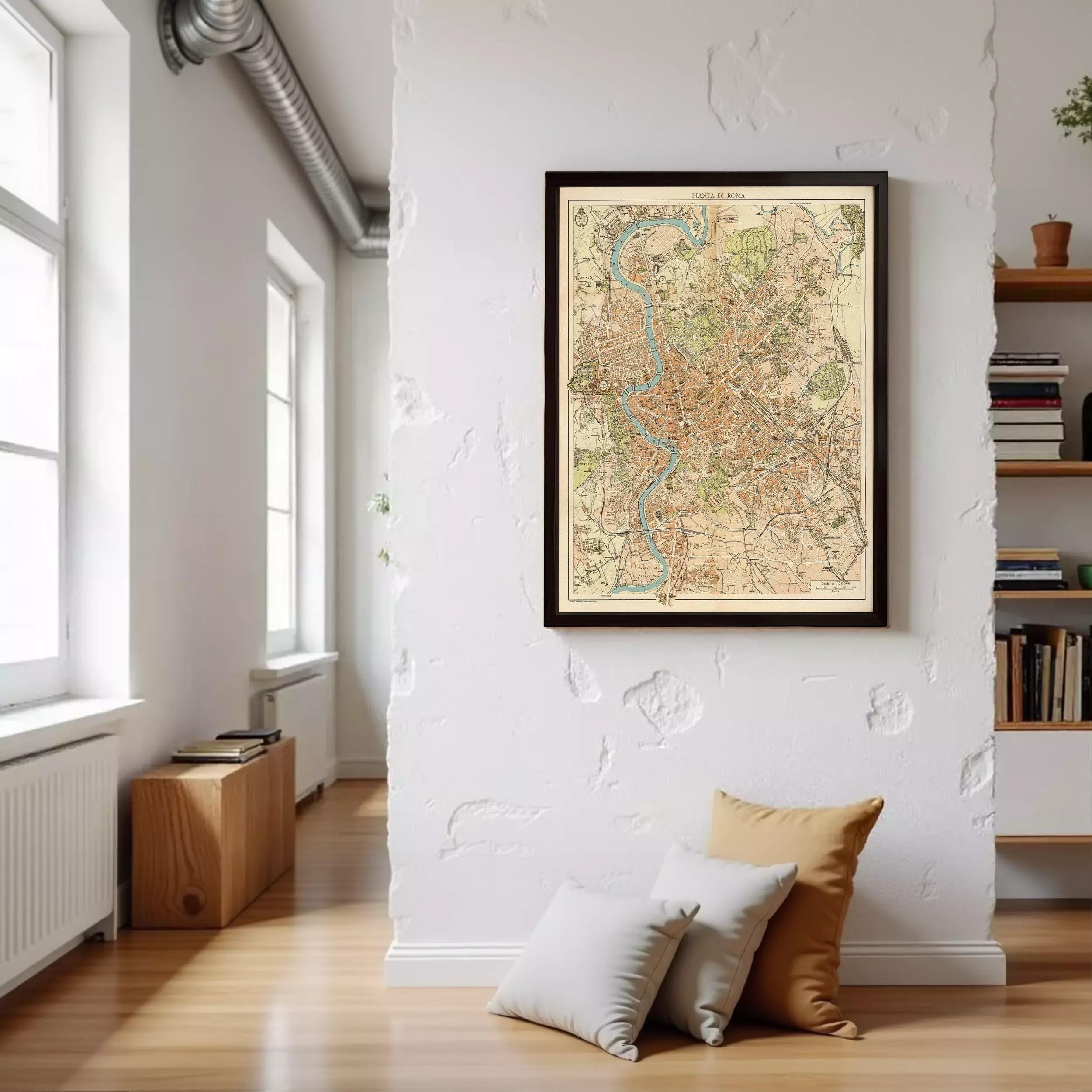 a large framed map of a city hanging on a white wall in a room with a wooden floor and a bookshelf.