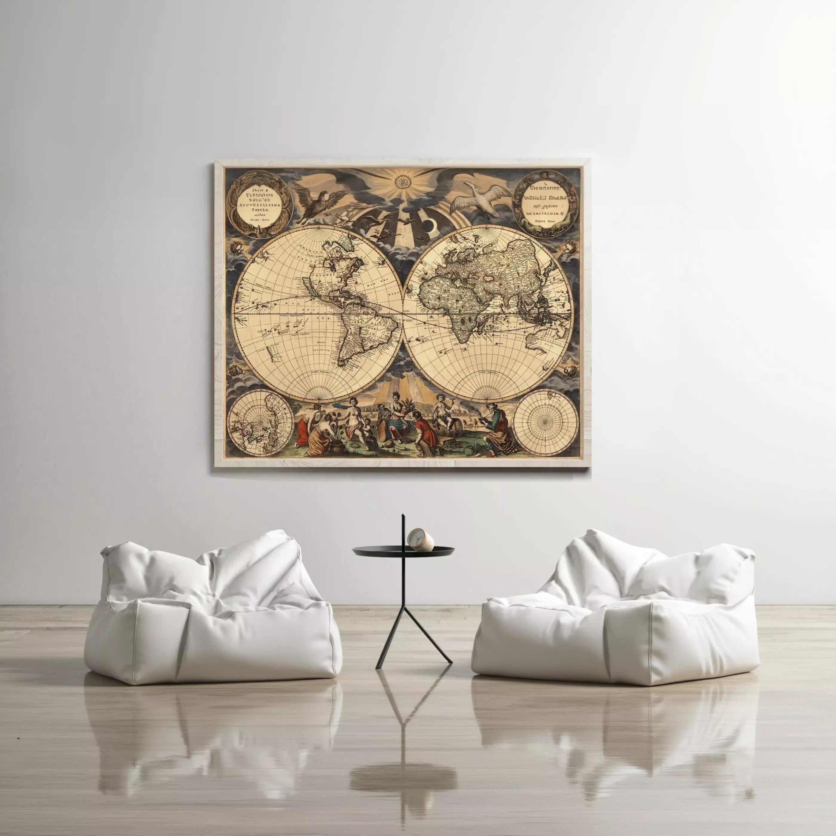 a large, antique world map hanging on a white wall, with two white bean bag chairs positioned in front of it.