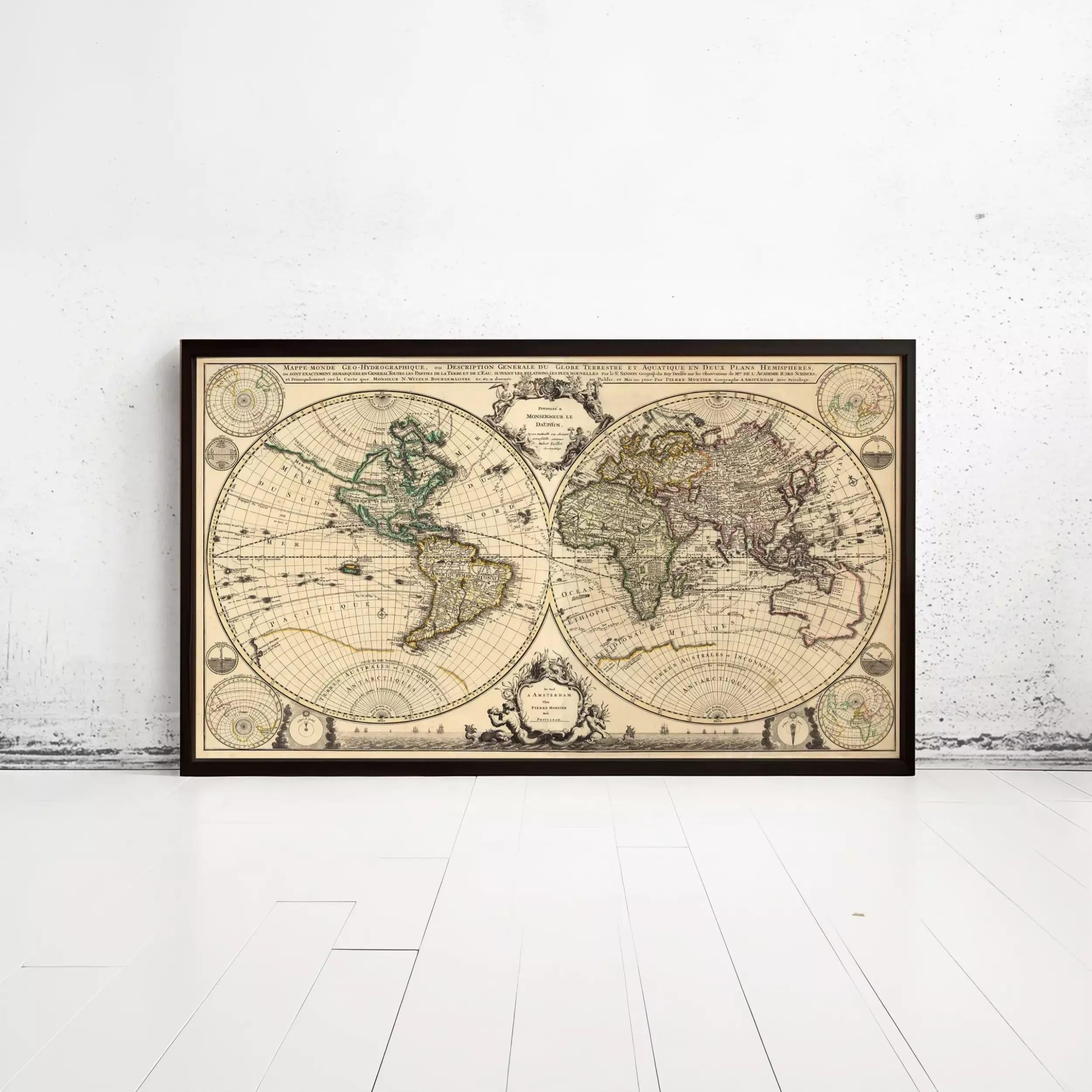 The image is a framed vintage map of the world, depicting the continents and oceans in a detailed and intricate manner.