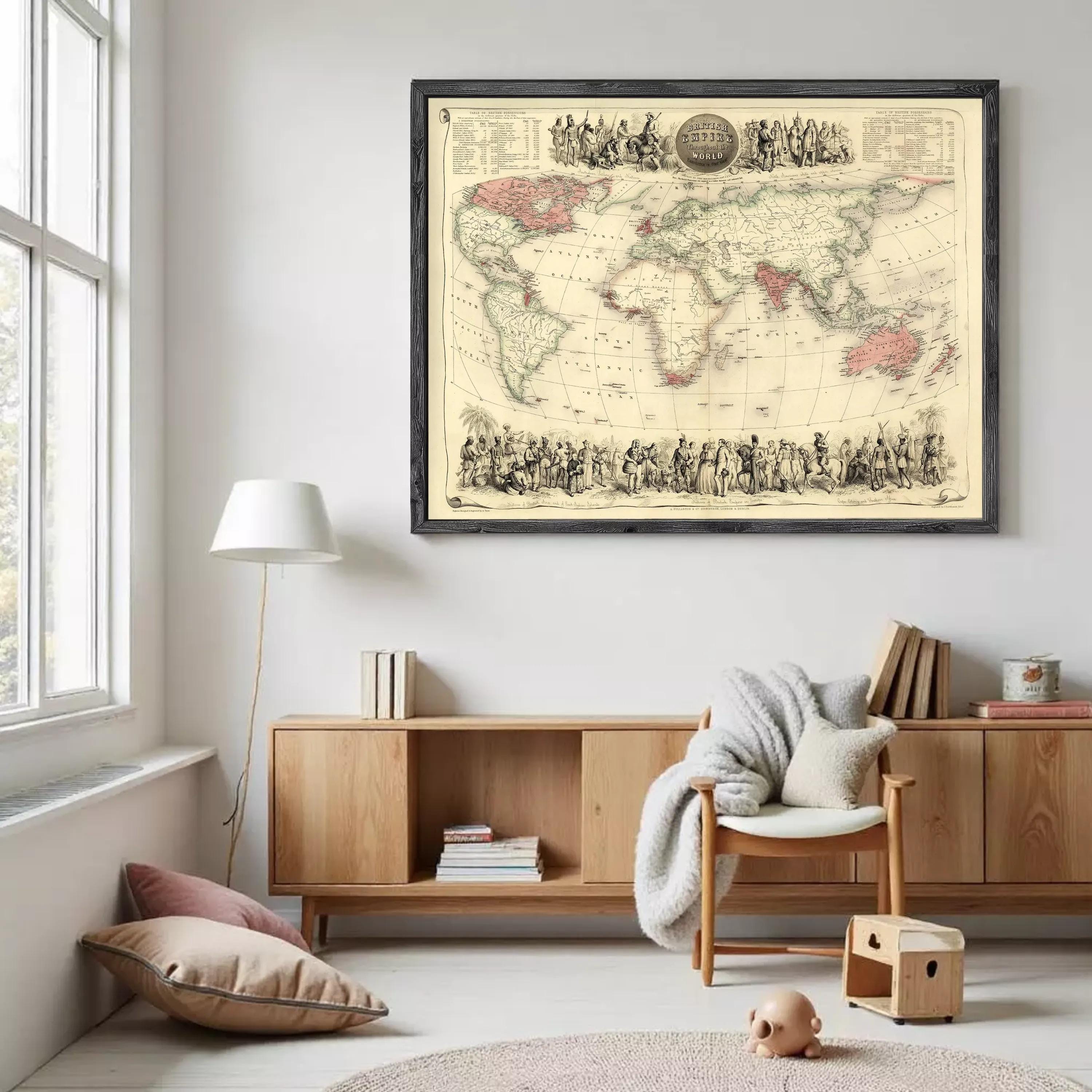 a large world map hanging on a wall in a room with a wooden cabinet, a lamp, and a chair.