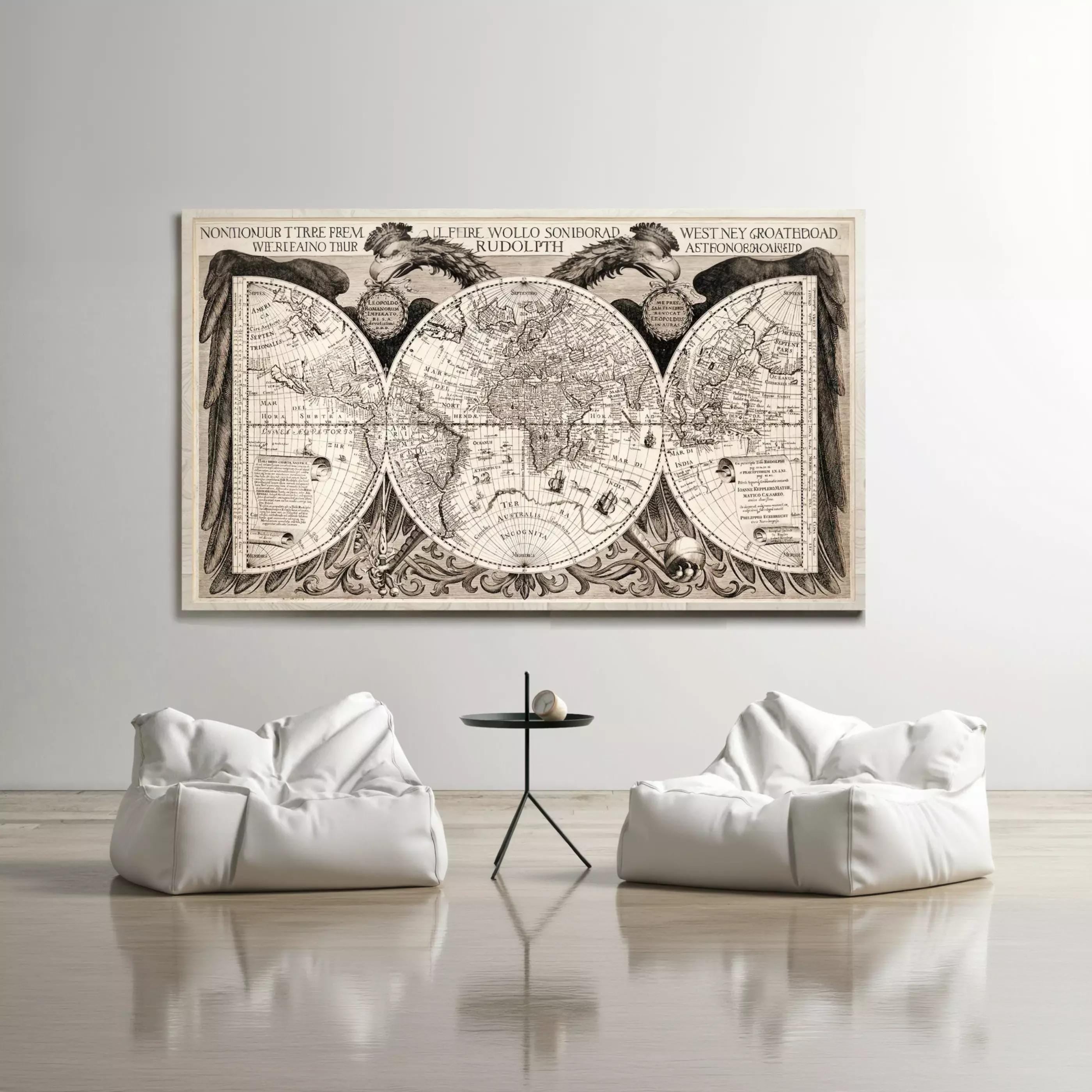 a large, detailed world map hanging on a wall, with two white bean bag chairs positioned in front of it.