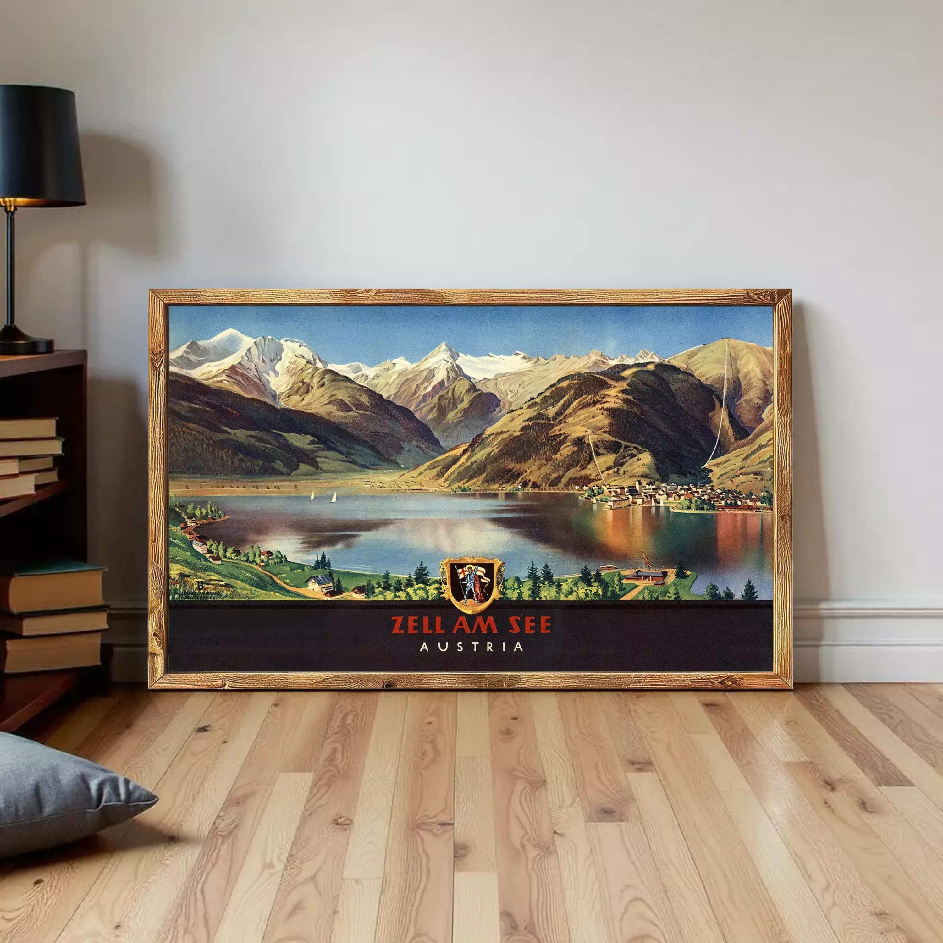 A framed vintage poster depicting a scenic mountain landscape with a lake and a town in the foreground, with the text "ZELL AM SEE AUSTRIA" prominently displayed.
