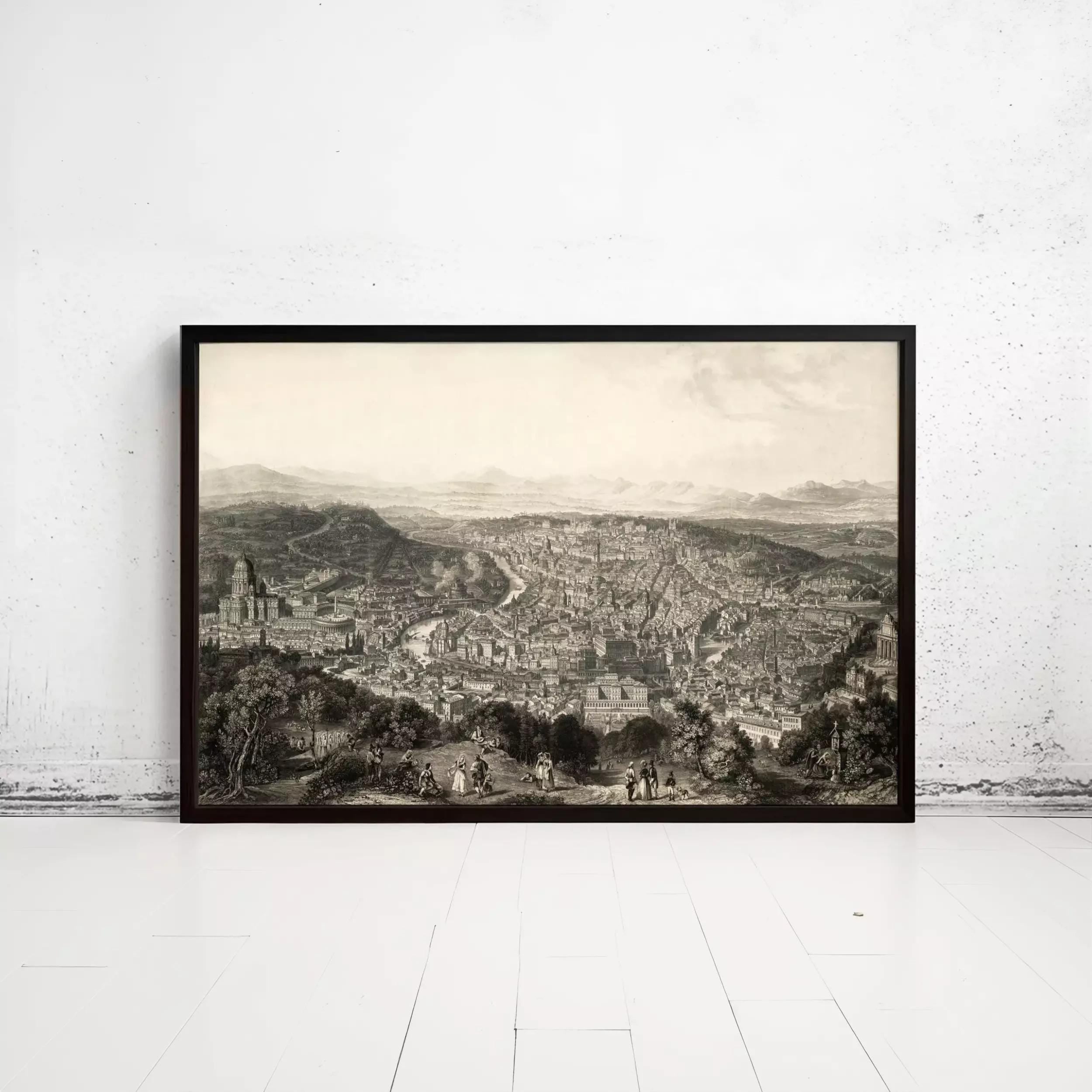 A large black and white framed print depicting a cityscape with buildings, hills, and people in the foreground.