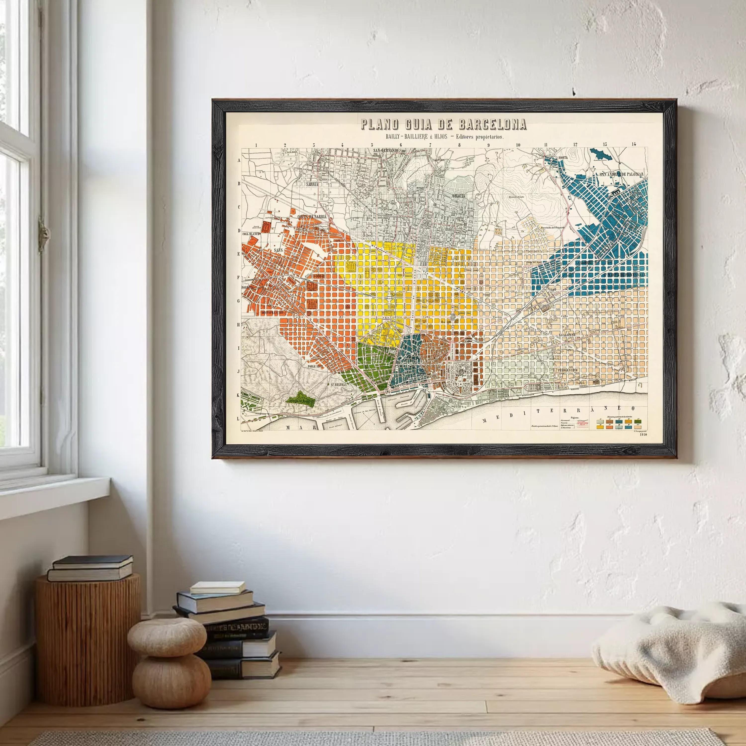 a framed map of Barcelona, Spain, hanging on a wall in a room.