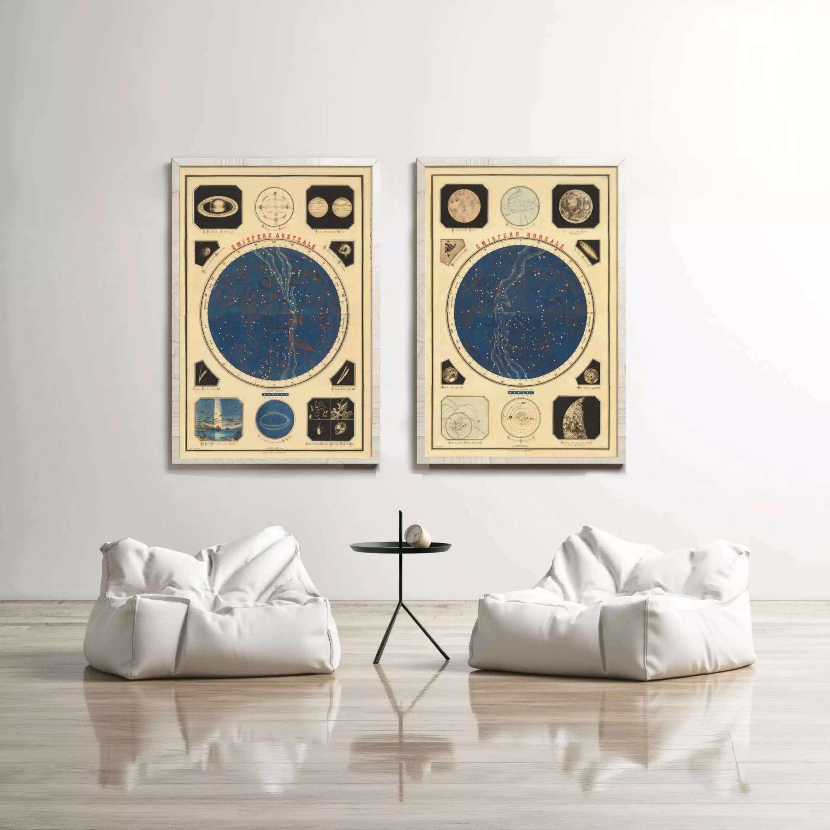 two framed artworks hanging on a white wall, each depicting a different celestial object or scene. In front of the artworks, there are two white bean bag chairs arranged in a U-shape, creating a cozy and inviting atmosphere.