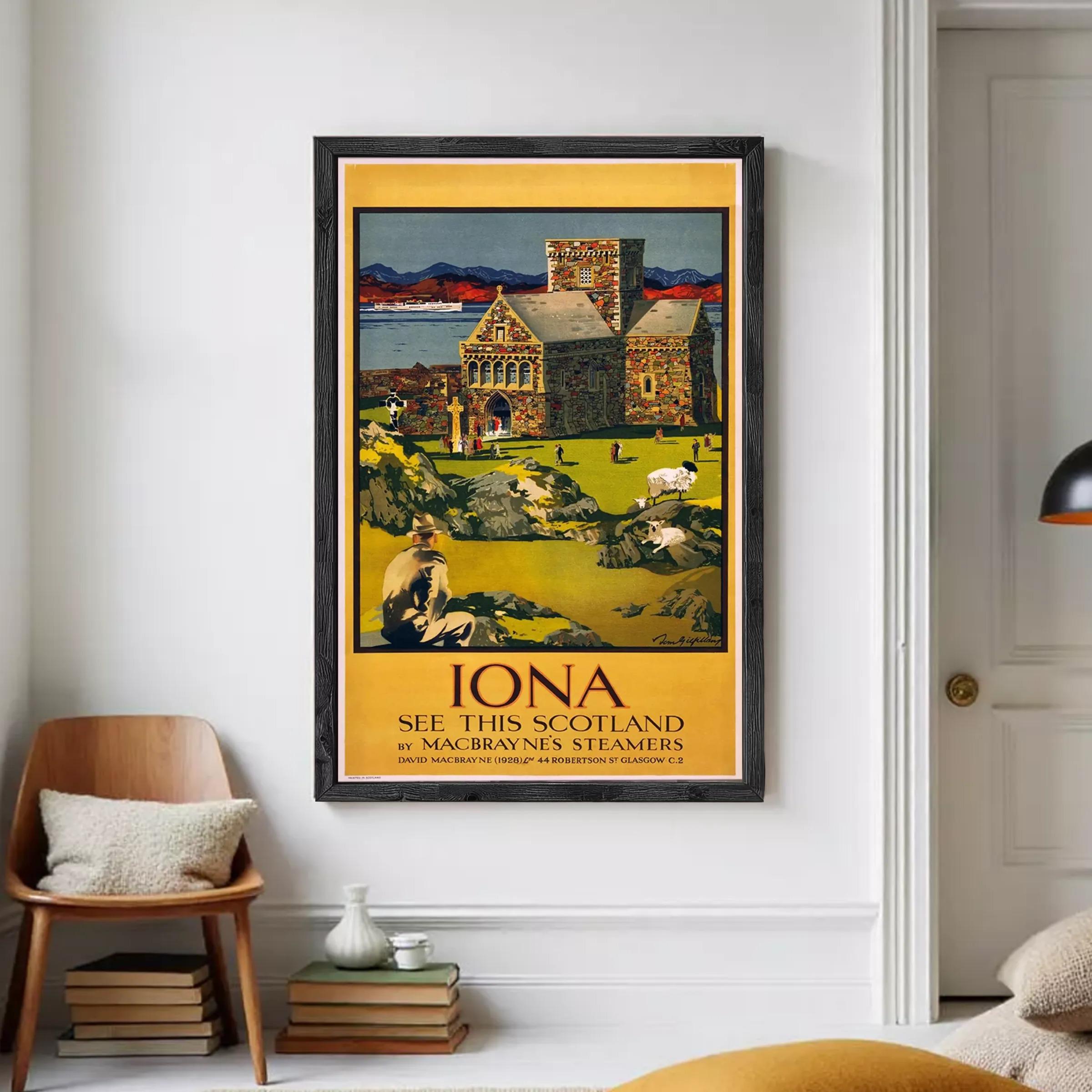 A framed vintage poster depicting a scenic view of Iona, Scotland, with a castle, mountains, and a river in the background.