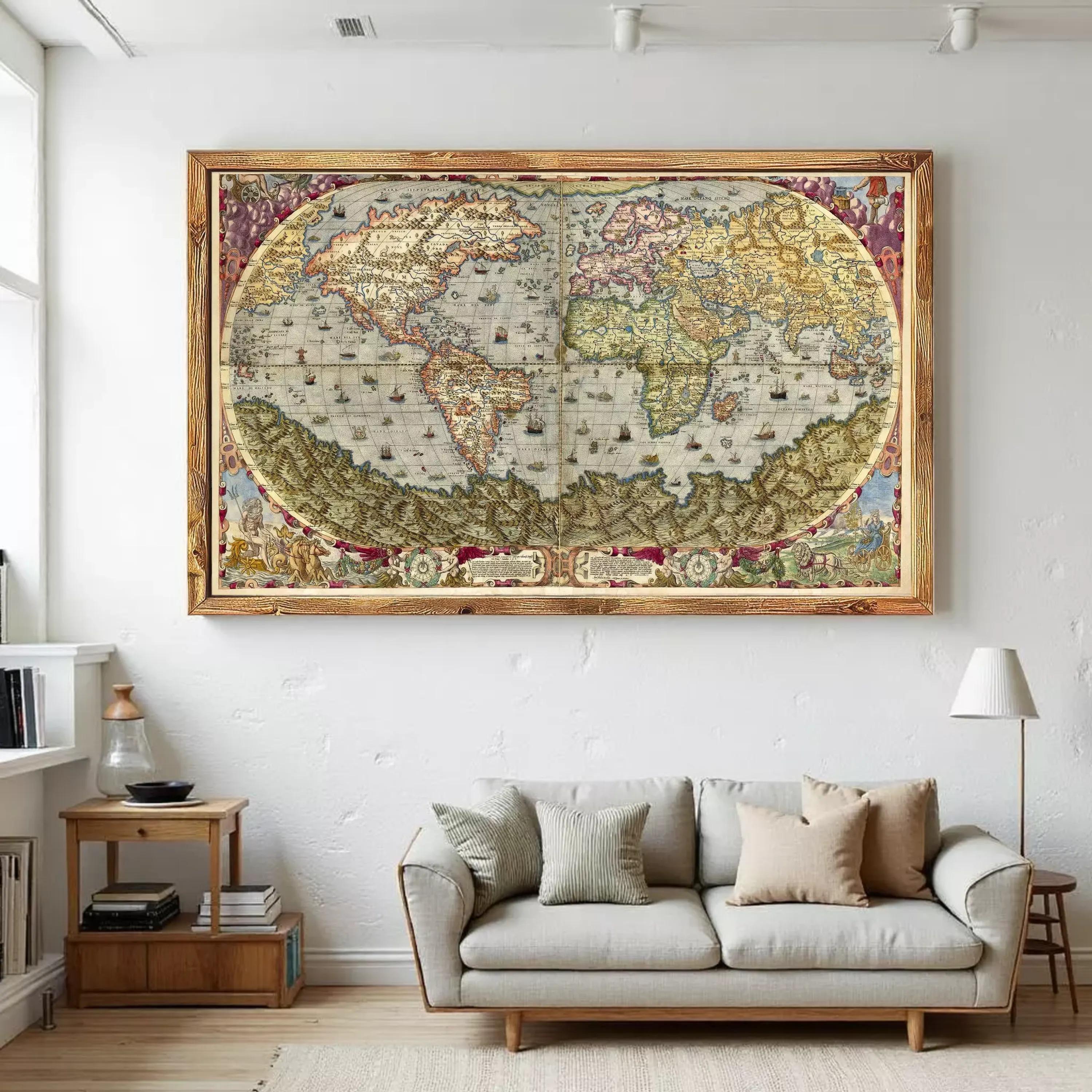 a large, ornate, antique world map hanging on a white wall above a gray sofa in a living room.
