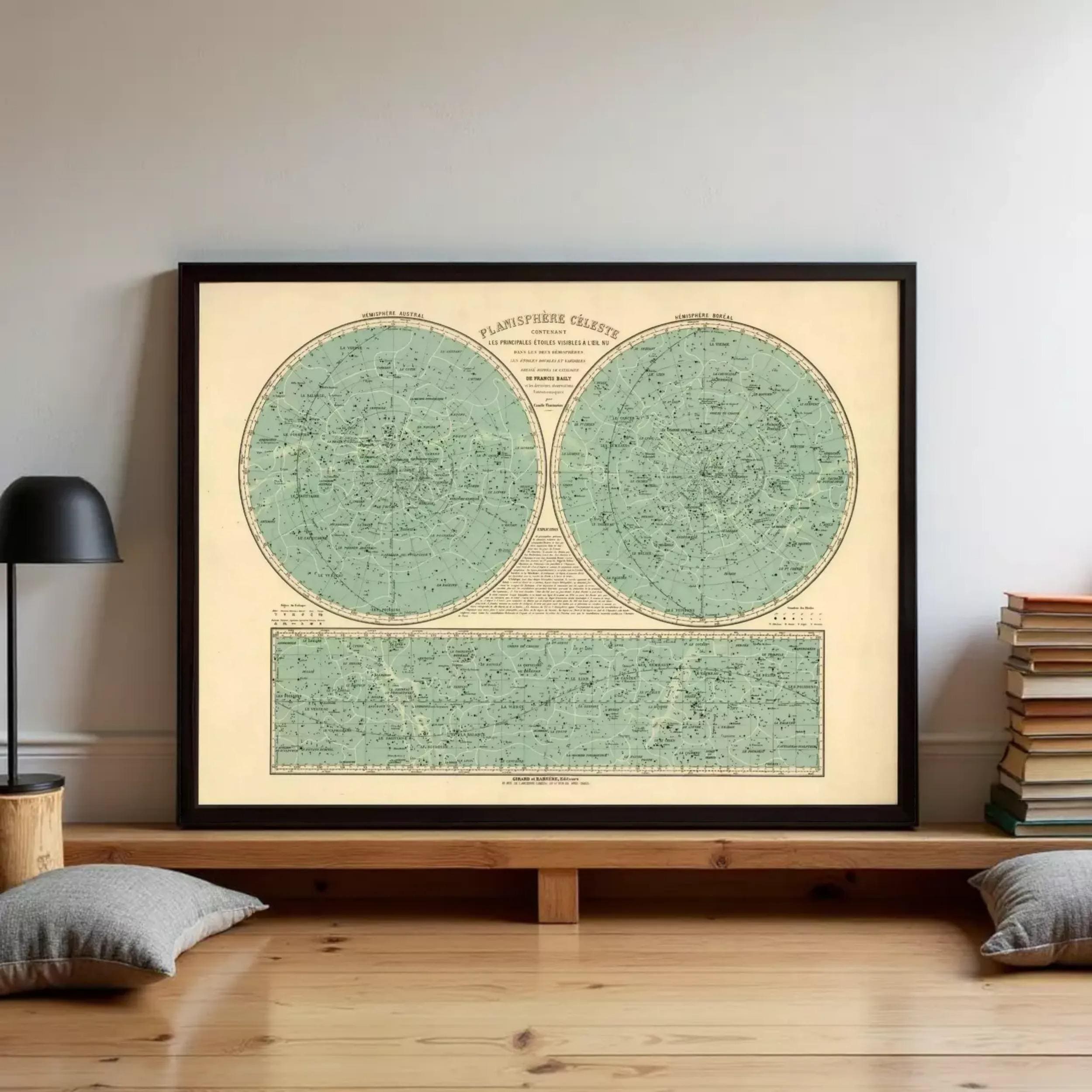 a framed vintage map of the night sky, with a wooden shelf below it.