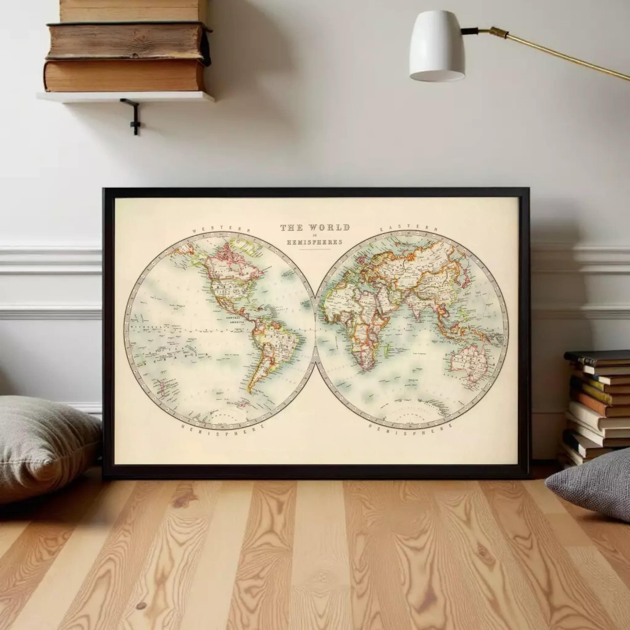 a framed vintage world map with the title "The World in hemispheres" displayed on it.