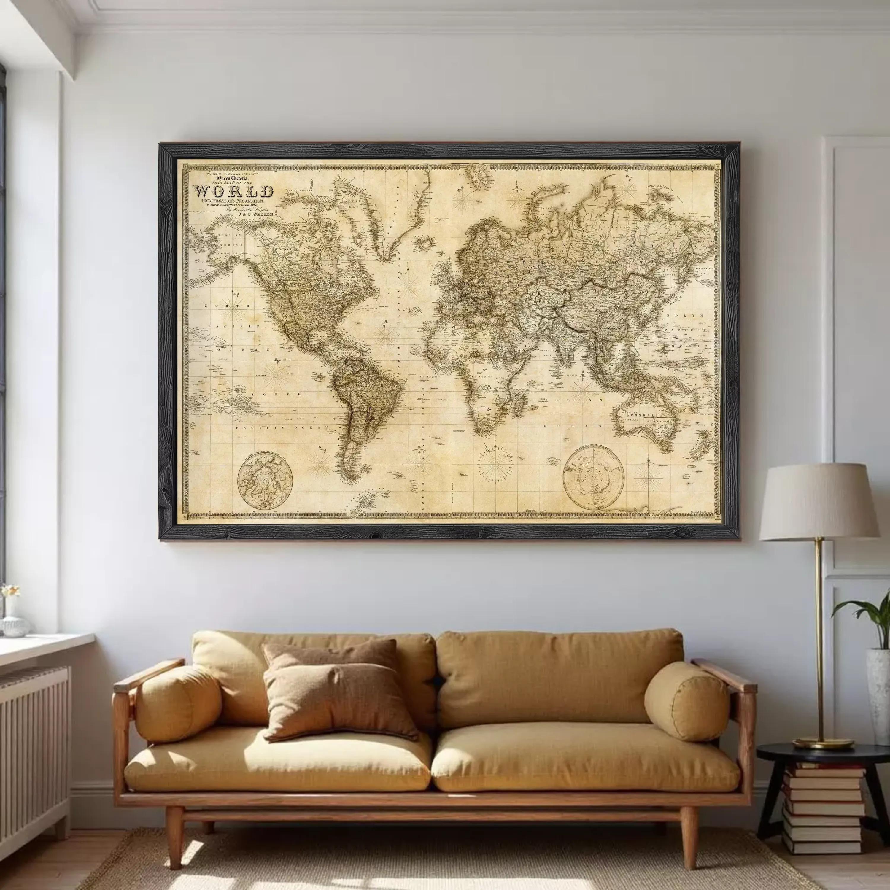 a large world map hanging on a wall above a brown sofa in a living room.