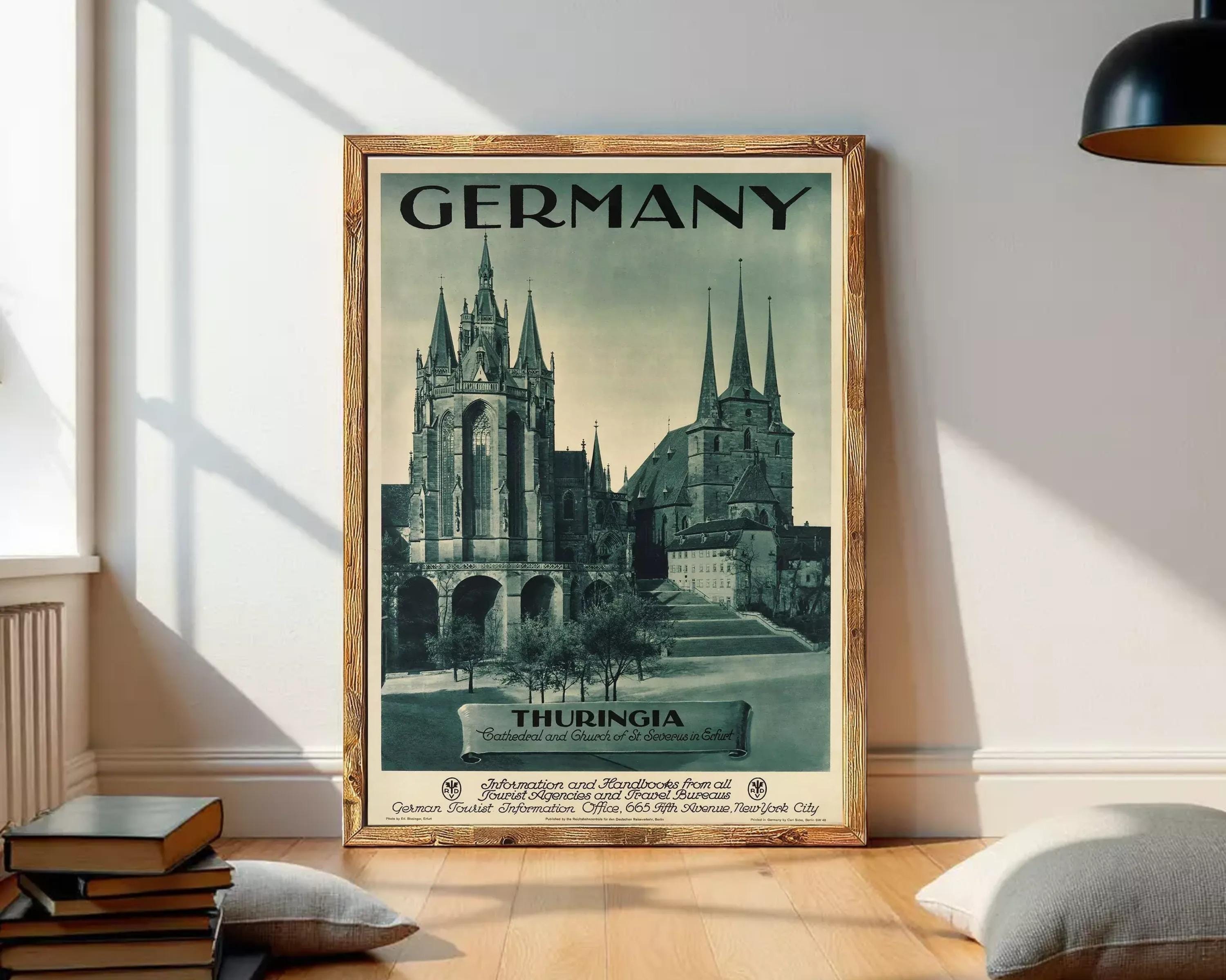 The image is a framed vintage travel poster advertising Germany, featuring the spires of the Church of St. Stephen in Thuringia.