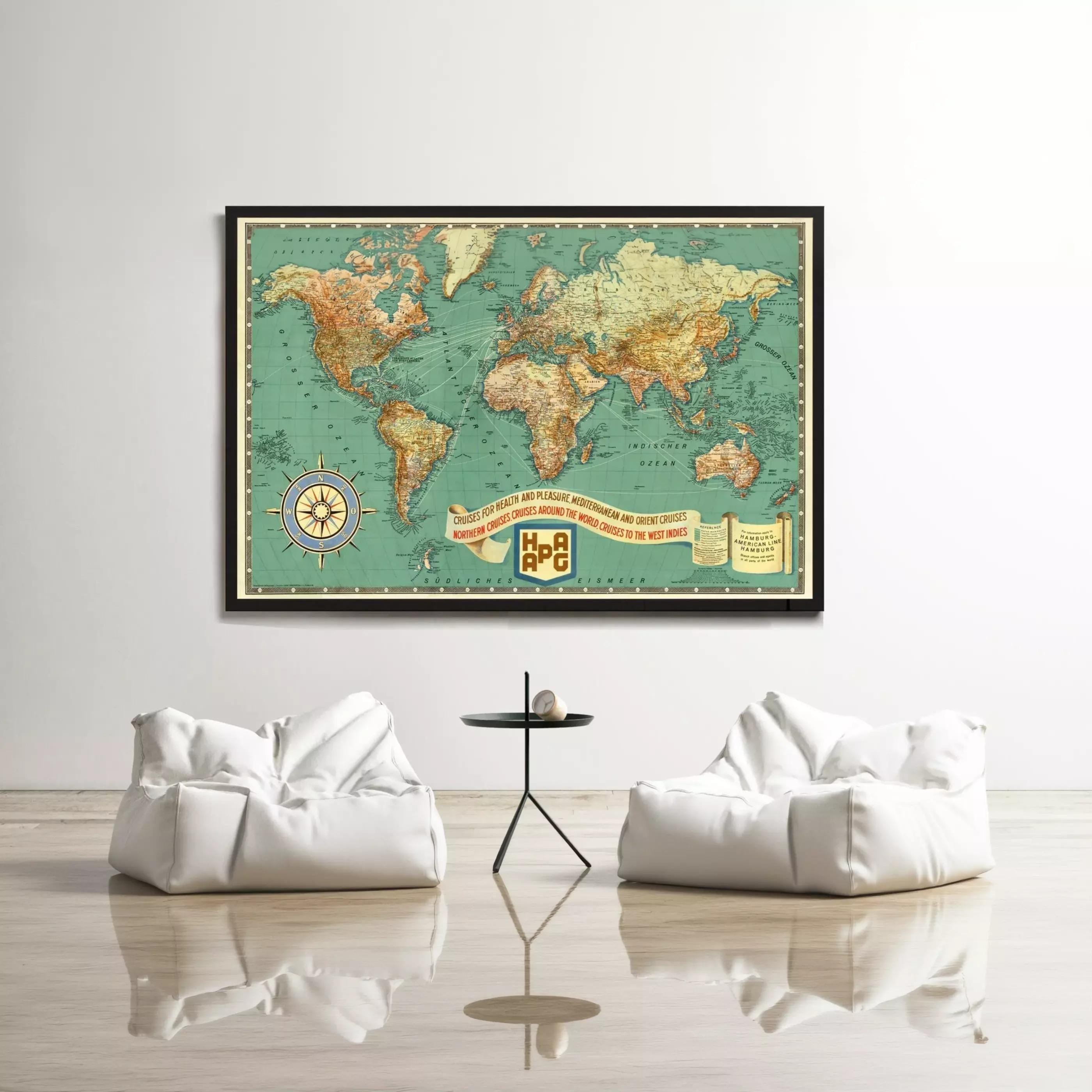 a large world map hanging on a wall, with two white bean bag chairs positioned in front of it.