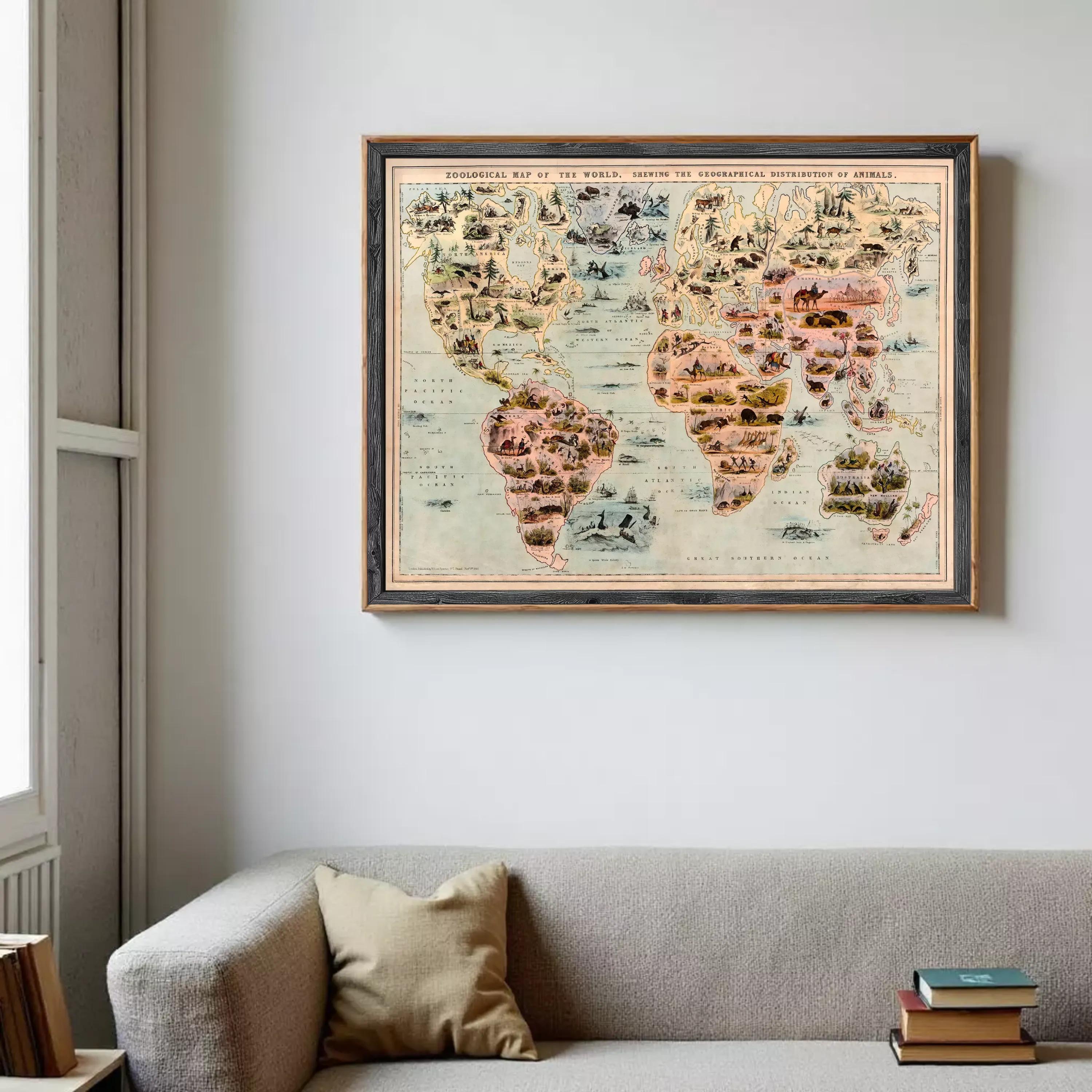 a large, colorful world map hanging on a wall above a gray couch.