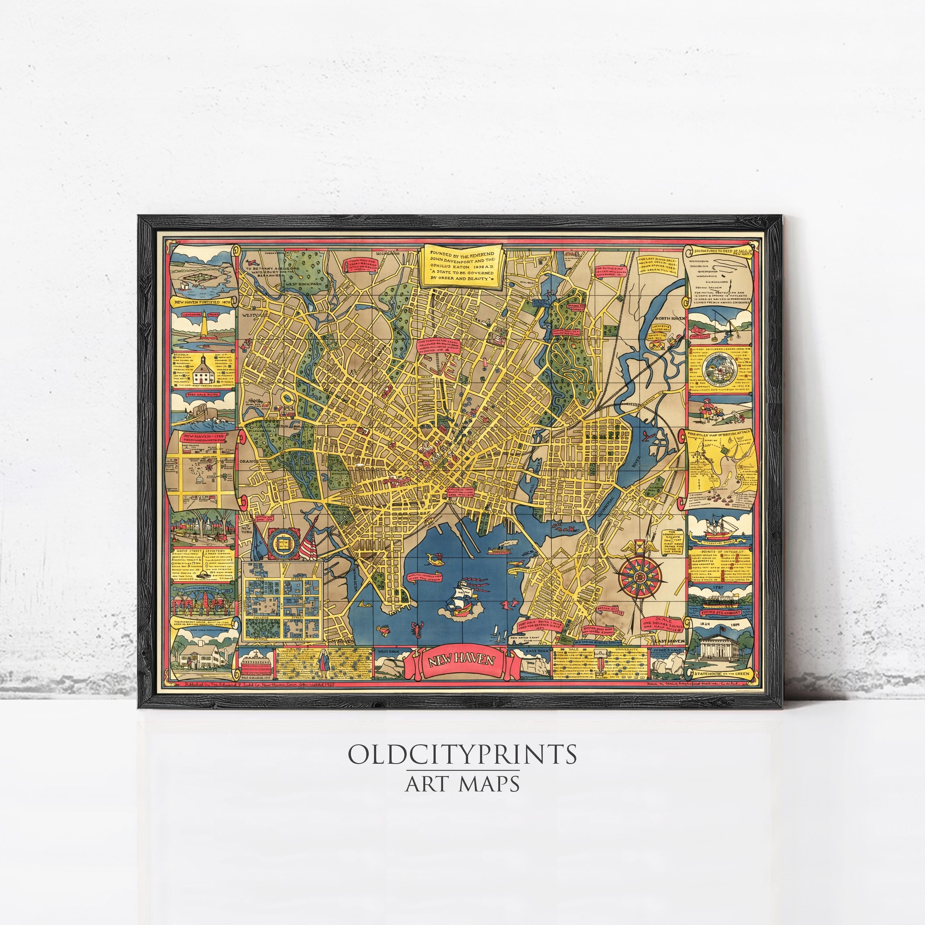 The image is a framed vintage map of a city, likely from the 19th century, with various landmarks and streets depicted in a colorful and detailed manner.