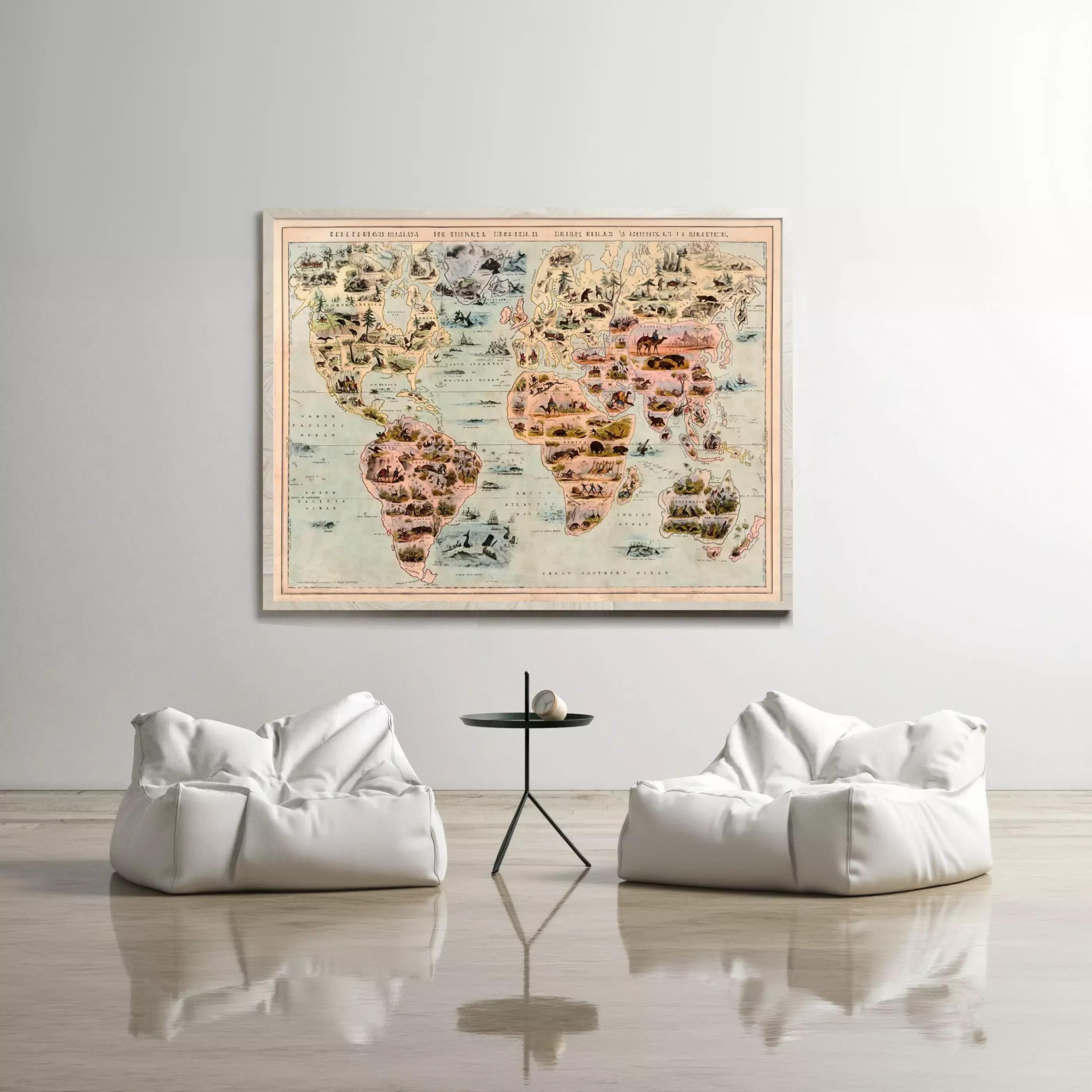 a large world map hanging on a wall, with two white bean bag chairs positioned in front of it.