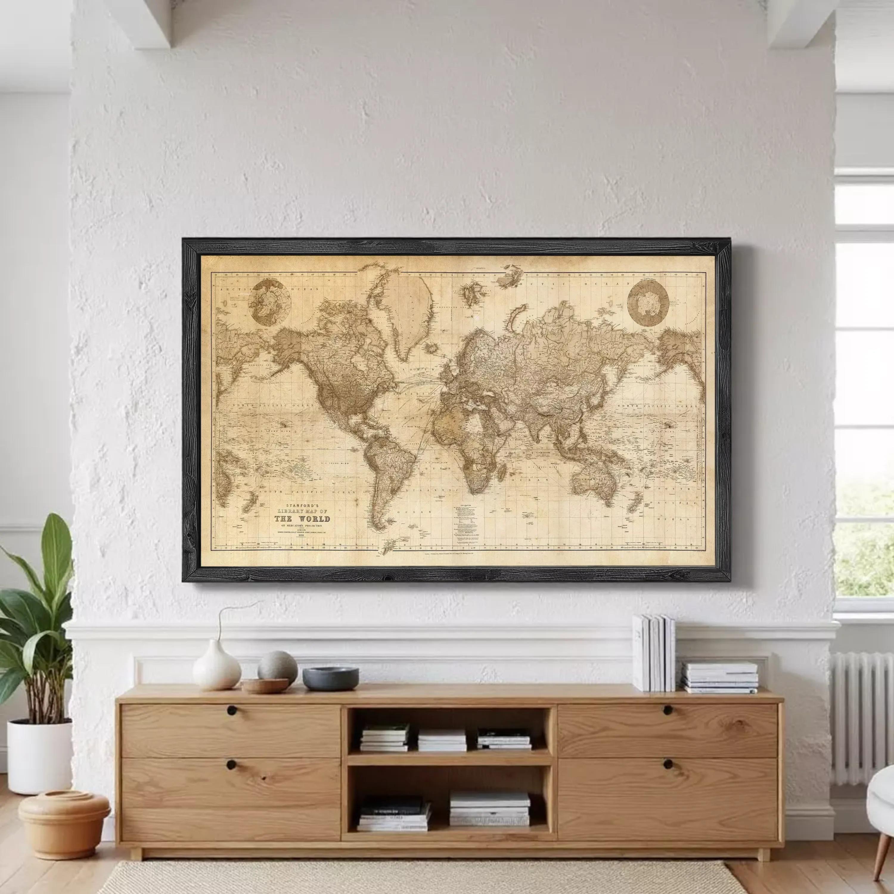 The image is a framed vintage world map with a black border.