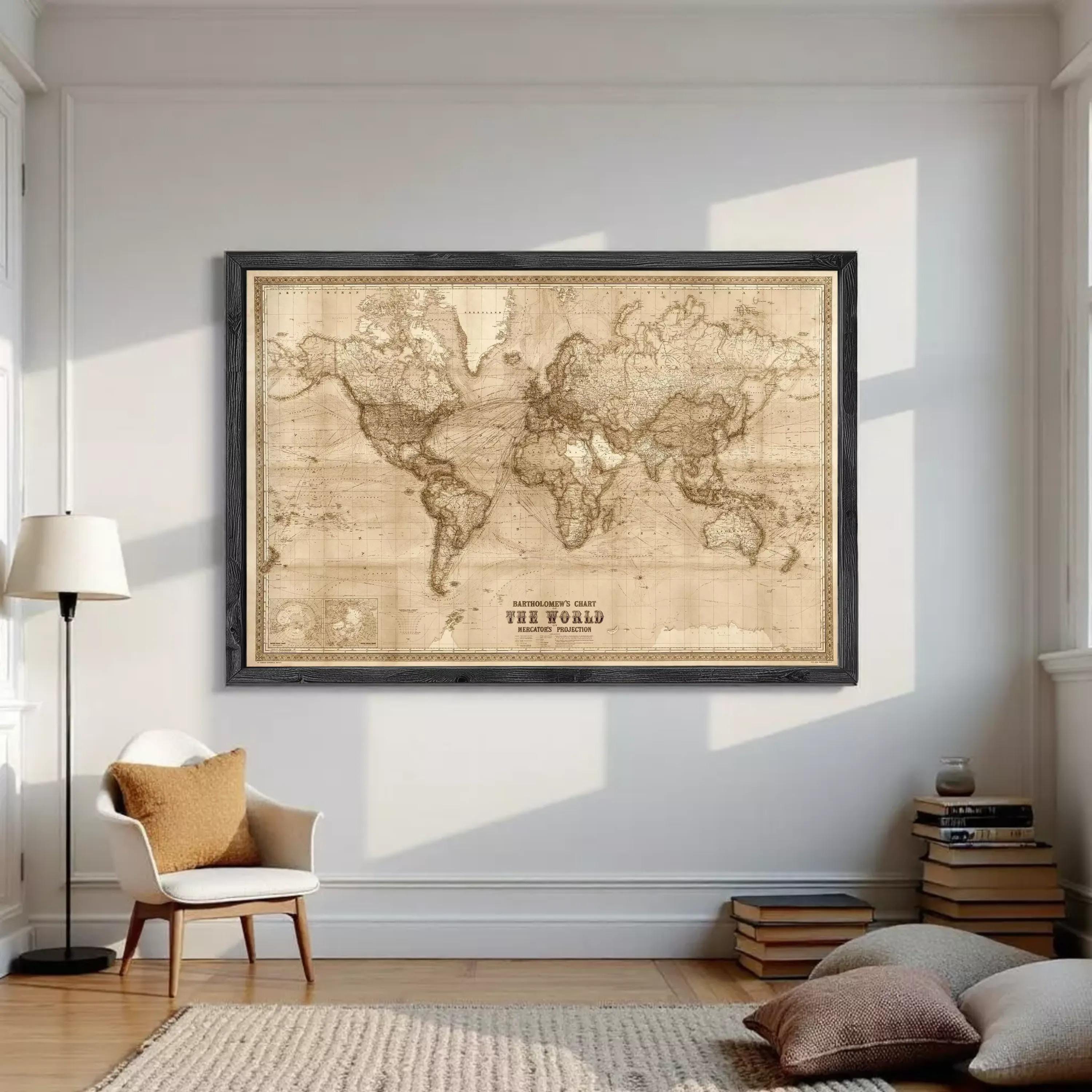 The image is a framed vintage world map with a black border, displayed on a white wall.